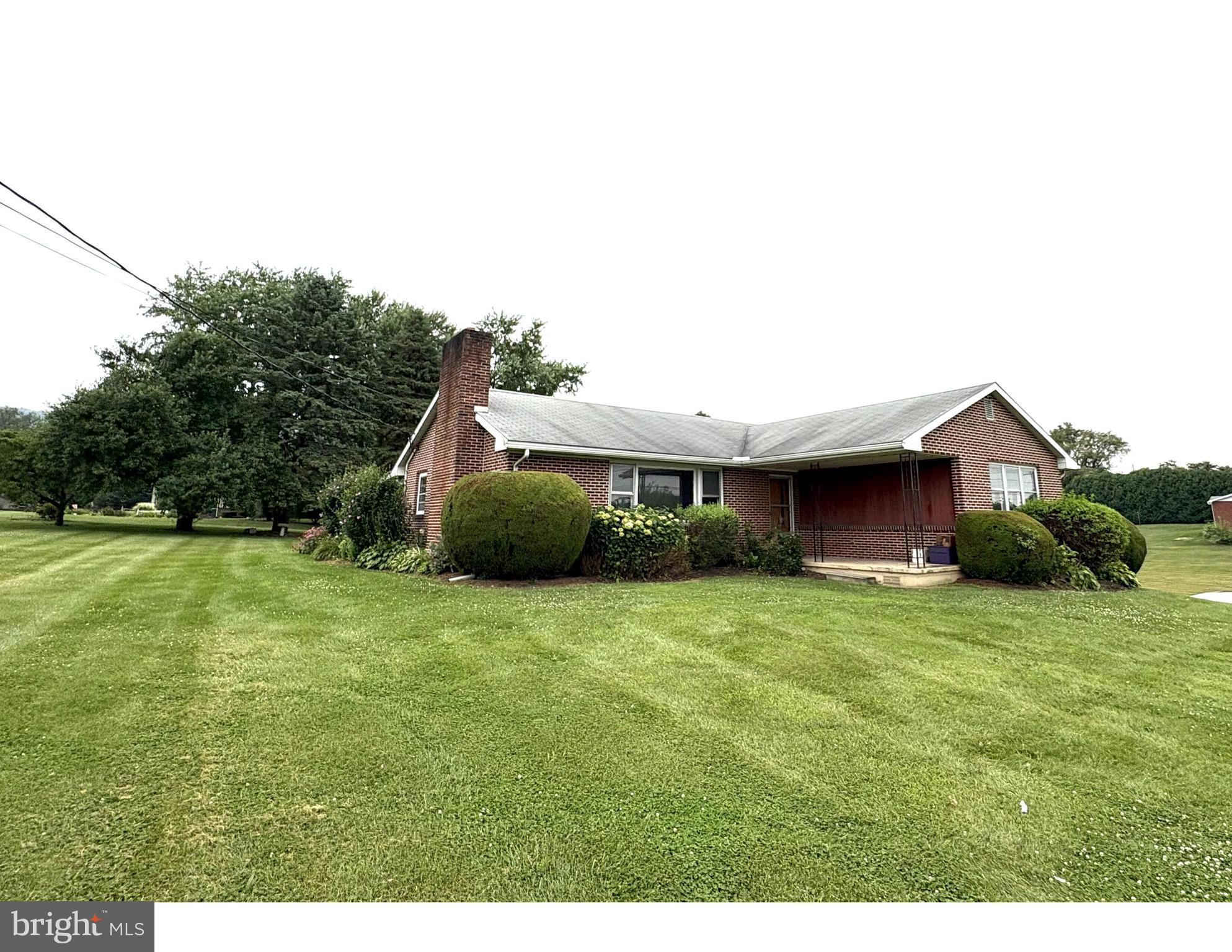 Welcome to 1546 E. College Avenue – a wonderful opportunity to make this solid brick ranch your own! Situated on a generous .77-acre lot in a convenient location, this three-bedroom, one-and-a-half-bath home offers over 1,400 square feet of above-grade living space with incredible potential. Step inside to discover hardwood floors, a cozy fireplace in the spacious living room, and an enclosed sunroom that adds extra versatility. The eat-in kitchen connects seamlessly to the living areas, creating a welcoming layout. The full basement features a half bath and plenty of space for storage, a workshop, or future finishing. Additional features include an integral two-car garage, a detached shed for added storage, and space to enjoy the outdoors. While this home is in need of updates and repairs, the structure and setting present an outstanding chance to build equity and create the home of your dreams. Located just minutes from Penn State University, Bellefonte, and State College. Don’t miss your chance to bring new life to this well-located property and make it shine once again!