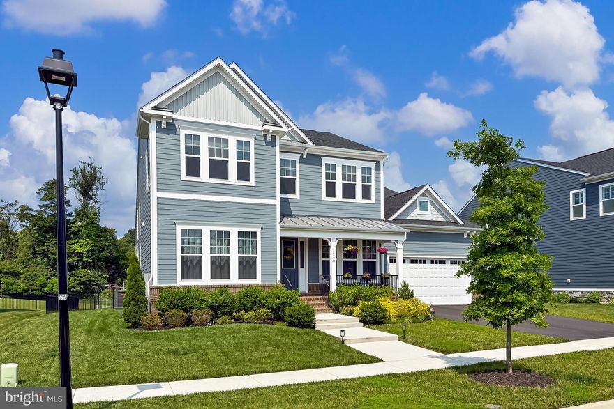 Welcome to 226 Stoic Street SE, a stunning showcase of modern elegance and luxury nestled in the heart of Leesburg, Virginia. This exquisite single-family home, built in 2022 by Van Metre Homes, features the sought-after Oatland model and is situated on a private premium lot. With over $182,000 in thoughtfully curated structural and interior upgrades, this residence offers the perfect balance of sophistication, space, and comfort.  Step inside and be captivated by nearly 5,000 square feet of beautifully finished living space. The open-concept layout is enhanced by soaring ceilings, wide-plank upgraded flooring and designer lighting that lend the entire home a sense of airy grandeur. The centerpiece of the main living area is a dramatic two-story fireplace, offering both visual warmth and an inviting focal point. The gourmet kitchen is a dream for chefs and entertainers alike, boasting a massive quartz island, top-of-the-line stainless steel appliances, crisp shaker style cabinetry, custom backsplash, and under-cabinet task lighting that add ambiance and functionality. The main level offers exceptional livability with a private office behind glass French doors, a laundry room with shelving, and a luxurious primary suite. The primary retreat features a tray ceiling, two expansive walk-in closets and a spa-inspired en-suite bath with a frameless glass shower, custom tile, and a sweeping dual vanity that defines luxury. An additional bedroom with a generous walk in closet and a stylish dual entry full  bath complete the main level, providing versatile space for guests or multi-generational living.
Upstairs, two more generously sized bedrooms, a full bathroom and an open family room space provide comfort and privacy for family or guests, with each room thoughtfully designed with attention to detail. The fully finished walk-up basement is an entertainer’s dream, offering a large recreation room, an adjacent theater room, one additional finished bedroom with walk-in closet and a second unfinished bedroom, and a beautifully appointed full bathroom. Whether you envision a home gym, second office, or private guest quarters, the lower level provides ample flexibility to suit your lifestyle.  Step outside from the beautiful screened in porch to your personal outdoor oasis facing mature trees. The backyard is designed for year-round enjoyment and unforgettable gatherings with stunning sunset views providing the perfect backdrop for evening relaxation. Located in a quiet, picturesque neighborhood, this home is part of a community that offers exceptional HOA amenities including an outdoor pool, playgrounds, and beautifully maintained common grounds. HOA fees conveniently cover common area maintenance, trash removal, snow removal, reserve funds, and professional management. The location couldn’t be more ideal—just minutes from commuter routes including Highways 267 and 7, and within ten minutes of Leesburg’s finest attractions such as the historic downtown district, Leesburg Premium Outlets, Costco, Wegmans, and Trader Joe’s. Wine lovers will appreciate the proximity to some of Northern Virginia’s best vineyards, while outdoor enthusiasts can explore numerous nearby parks and scenic trails. Whether you're seeking a forever home or a refined weekend retreat, 226 Stoic Street SE offers a rare opportunity to enjoy the best of Leesburg living. This home is ready for you to move right in and start enjoying everything it has to offer.  Don’t miss your chance to own this extraordinary and charming Leesburg property. Schedule your private showing today and experience the perfect blend of luxury, comfort, and convenience.