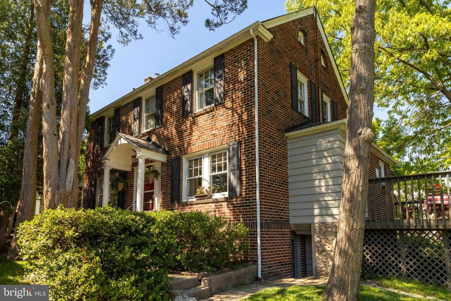 PROF PHOTOS COMING SOON! Welcome to a classic 2 story brick  center hall colonial maintained and loved over the years. Parking is never a problem. Drive down the private driveway to the 2 car det. garage  & 2+ parking places in the rear. Gleaming hardwood floors throughout. Each room is spacious with an abundance of windows. The fireplaced living room is perfect for cozy evenings or great entertaining. A formal dining room  for casual or elegant dining. The bonus room with windows on 3 sides is a perfect office area or play room. Wonderful kitchen with ss appliances, large enough for island or table & chairs, porcelain sink, stove with air-fry feature. The convenient half bath  with pantry/utility closet makes this 1st floor complete. Second floor with King Size main bedroom has updated full ceramic tile bath having a great walk in shower. The updated ceramic tile hall bath with tub is  top shelf. A great surprise is the formal staircase to the attic, just waiting for finishing or to accommodate  serious storage. The carpeted finished portion of the basement is super for family room, exercise area, or serious gaming  etc. Let your imagination run wild. The Laundry room with gas dryer, full size washer & substantial space for laundry needs or more storage. The utility room houses the heater/boiler and hot water heater with yet additional storage capabilities. The oversized deck lends to fabulous views of the property and landscaping. Convenient location for bus, train, shopping, restaurants, parks etc. walk to Copper Beech Elementary, Abington Middle and Abington High Schools. And located in prestigious Glenside Gardens neighborhood.