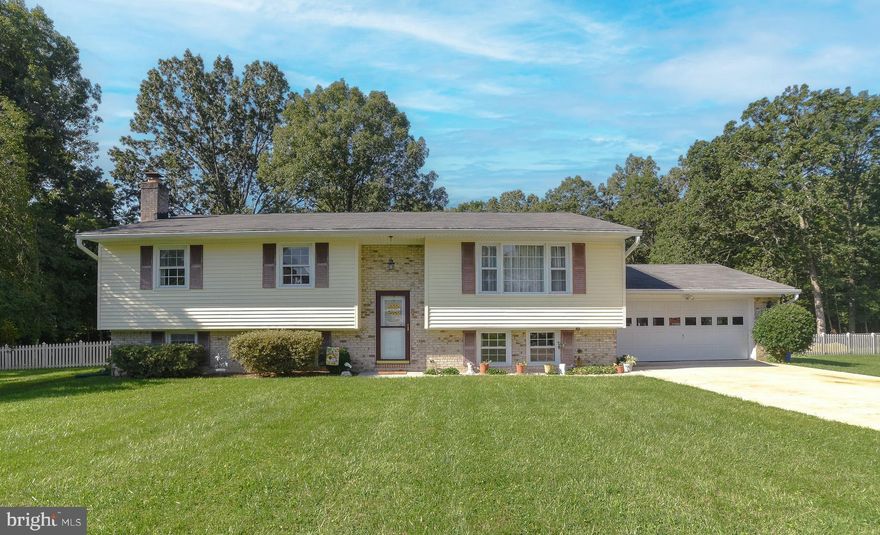 Discover a spacious and charming split-level haven in the tranquil community of Spring Valley. This meticulously maintained 3-bedroom, 2-bathroom residence is set on a sprawling .85-acre lot, offering the perfect blend of comfort and potential.
As you enter, the solid wood floors in the welcoming foyer set the tone for the quality and warmth of this home. The upper level unveils a generously sized formal living room, drenched in natural light and featuring a large window with serene views. Adjacent to the living room, the formal dining room is the ideal space for hosting intimate gatherings and special occasions.
The kitchen, spacious and well-appointed, awaits your personal touch. Equipped with a refrigerator, range/oven, built-in microwave, dishwasher, and a large double sink, it provides an excellent foundation for your culinary aspirations. The original wood cabinets and countertops offer plenty of space and storage.
Off the dining room, you'll find a versatile sun/morning room with a captivating view of the extensive backyard. Step out onto the porch, where a convenient stairway leads to the backyard. The outdoor space is an oasis for outdoor enthusiasts, featuring an inviting inground pool, a large sport court, and two sheds for storage. Enjoy the tranquility of the wooded area behind the property, where you can observe wildlife and songbirds while relaxing in the shade of mature trees, and there's plenty of room for gardening.
The primary bedroom, a peaceful retreat, features an en-suite full bathroom with a walk-in shower, providing convenience and privacy. An additional full bathroom in the hallway with a bathtub serves the other two spacious bedrooms.
The lower level boasts an expansive family room with a cozy wood-burning brick fireplace, offering an inviting space for gatherings. An adaptable flex room with a closet presents potential for a home office, playroom, or guest space. The large utility/laundry area includes ample shelving for storage convenience.
Recent updates include the replacement of the HVAC system in 2018, featuring a UV light cleaner to safeguard against allergens and mold. Additionally, a back-up battery has been added to the sump pump for peace of mind during power outages. Roof was replaced in 2008 and still has plenty of life.
Situated in a quiet neighborhood, this property provides a peaceful and family-friendly environment. Convenience is at your doorstep, as the home is located close to shopping, entertainment, military bases, and major commuter routes, making it an ideal choice for those seeking both tranquility and accessibility.
This exceptional property, cherished and maintained by its original owners, offers an incredible opportunity to create a lifestyle of comfort and convenience. With a little vision and personalization, you can turn this house into your dream home. Don't miss the chance to make it your own – schedule a viewing today!