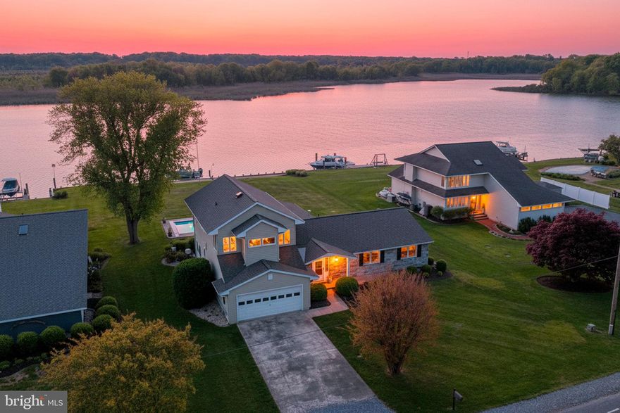 This waterfront home rests on the banks of Price Creek, a protected waterway leading to the Chesapeake Bay. Offering 4 bedrooms and 3 full bathrooms, the home features two spacious primary suites, each with en-suite baths and walk-in closets.

The open-concept floor plan is filled with natural light and showcases stunning water and pool views throughout. Step outside to the screened porch and enjoy gentle breezes and the peaceful sounds of nature. Take advantage of the upgraded saltwater pool, a private boat lift, and the peace of mind provided by a new roof installed in 2024, along with a home generator.

Inside, unwind in comfortable living spaces designed for both relaxation and entertaining, with seamless indoor-outdoor flow that makes the most of this exceptional waterfront setting. Enjoy the protected waters of Price Creek for kayaking, canoeing, or paddleboarding, or venture out to the Chesapeake Bay for a day on the water—all just steps from your back door.

Located in Queen Anne Colony, the community also boasts a marina and playground and the home is just minutes from a public walking trail and golf course.