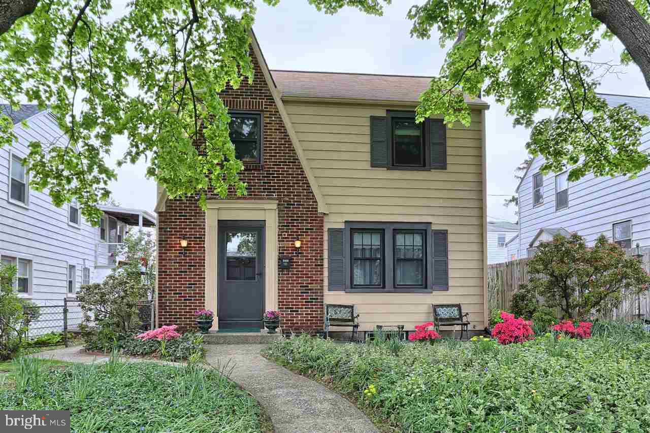 Charming storybook feel in this home with updates to both kitchen & baths. 300 square feet finished in lower level w/ceramic tile floors & full bath great for family room or additional BR. Nice looking laminate wood & ceramic tile on first floor. Charming fireplace. Relaxing sun porch leads to cozy rear yard w/deck & gardens with pond. Hardwoods on 2nd floor. Many original details. Replacement windows/storm door 2013. Low maintenance yard. Convenient location, quiet street. Great home ready for new owners!