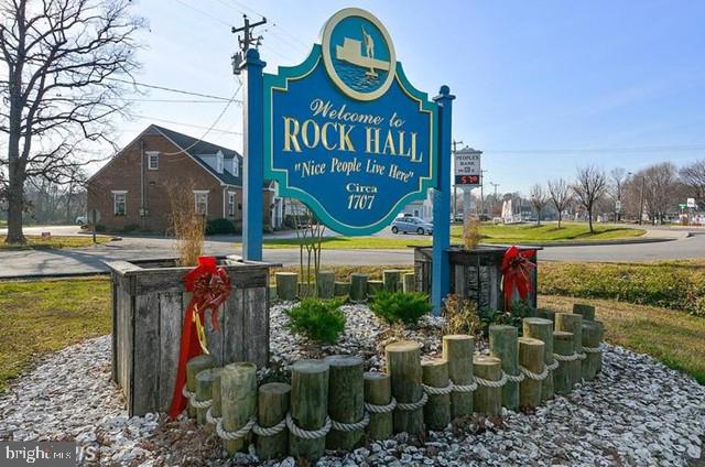 Enjoy the best of Eastern Shore living here in Rock Hall, Maryland. A Chesapeake Bay village with miles of shoreline, public docking, and many marinas. This lot offers a blank canvas to convert your dreams into reality. Secluded among mature trees while still being situated within walking distance to the shops and events on Main Street. Allocations for public water and sewer are available.