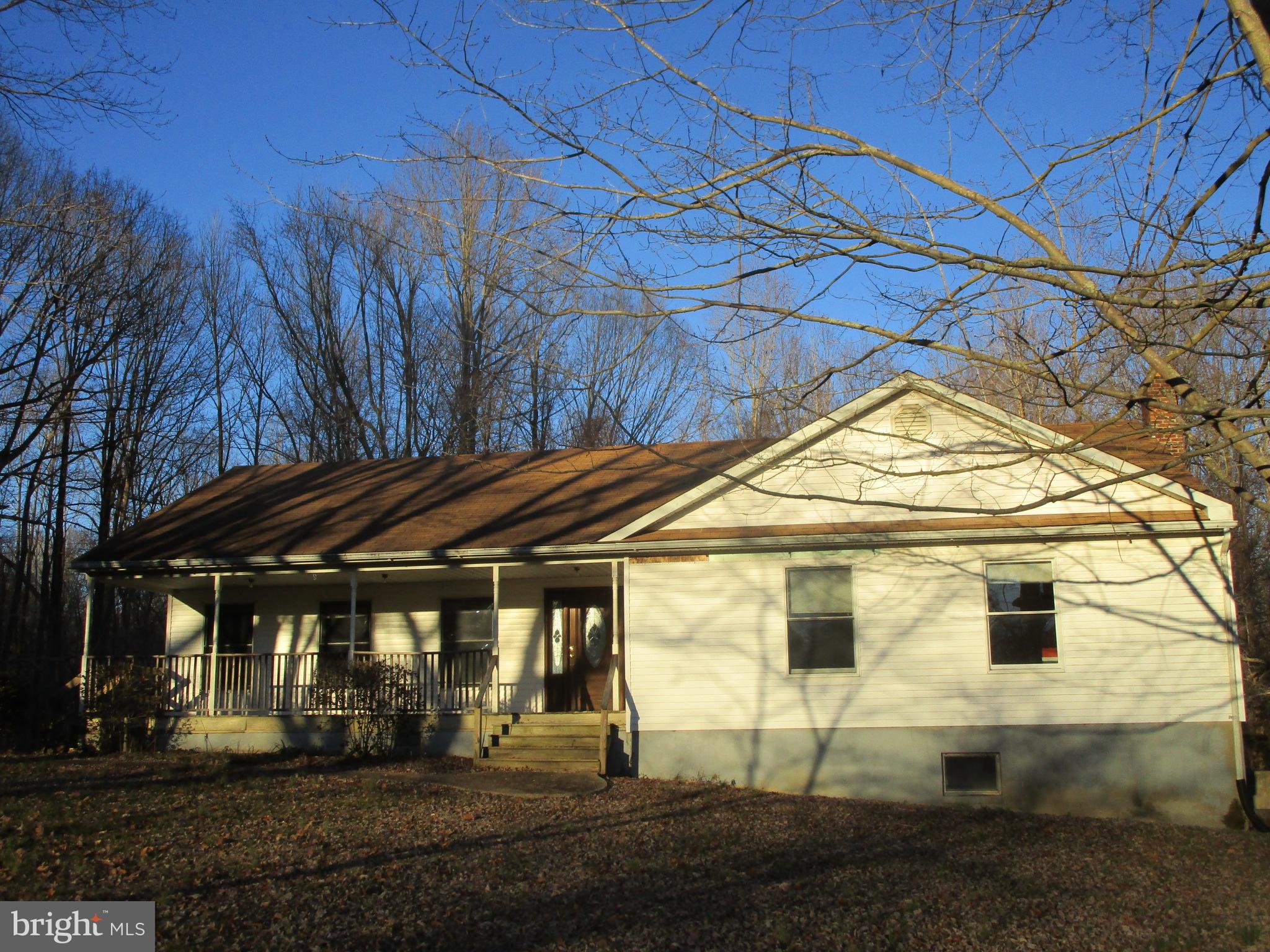 OUR ABILITY TO SHOW THIS PROPERTY REQUIRES NO DRIVEBY LOOKERS! PROPERTY CAN ONLY BE SHOWN BY APPOINTMENT SCHEDULED THROUGH AN AGENT! DO NOT GO TO THE PROPERTY WITHOUT AN AGENT AT THE SCHEDULED TIME! So you are aware, the use of Two Horse Lane is temporary and only available until the property goes to settlement. The buyer will be required to build a driveway from Armiger Rd to the house. Nice rambler on large lot located in a beautiful wooded, rural area in quiet neighborhood and near schools, shopping, restaurants, major commuter routes, and many other amenities. Hardwood flooring flows throughout the majority of the main level to include the large and open living, dining, and kitchen area, as well as the hall and 3 good sized bedrooms. The main level also offers a private master bath and a full hall bath. From the dining area and the master bedroom, there is a doorway to the screened-in rear porch where you can enjoy your privacy and the wooded view where you might very well catch a glimpse of the resident wildlife. Additionally, the main level provides a laundry/pantry/mud room which is accessed next to the kitchen or the convenient side door from the driveway. The basement has a level walkout side door and is unfinished, although there is a full bath in place. As reflected in the price, this home will need some work. Please note: This property can only be shown By Appointment.