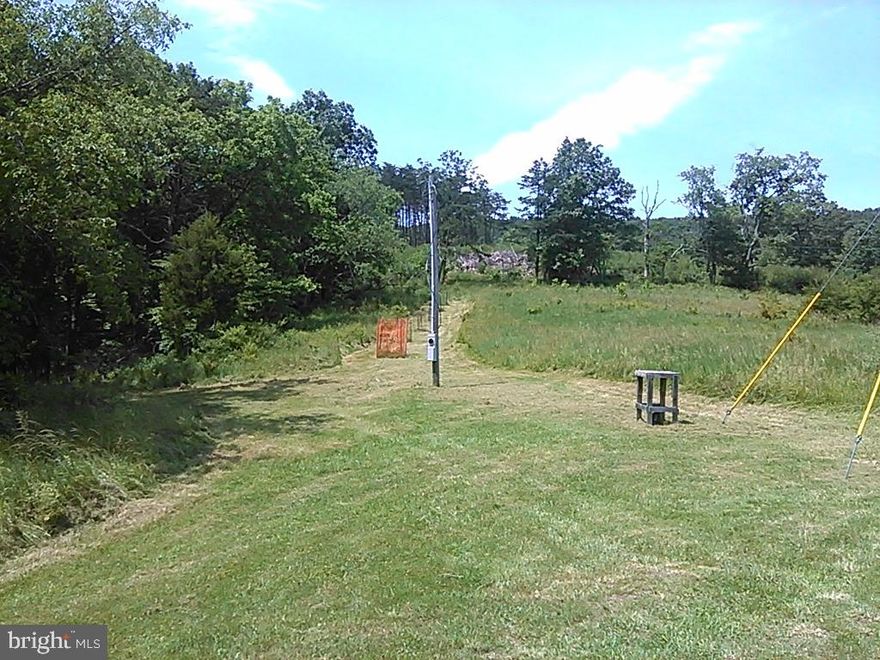 Discover 20.05 acres of opportunity in the gated community of Quivey’s Grove in scenic Hampshire County, West Virginia. This beautiful parcel offers mountain views, electric already on site, and has been perked, making it ready for your future plans. Whether you’re dreaming of building a full-time residence, a weekend retreat, or a private getaway, this property provides the flexibility to build, hunt, or camp. Enjoy peace, privacy, and the natural beauty of West Virginia while still having the security of a gated community. A rare chance to own usable acreage with infrastructure already in place—bring your vision and make it yours.