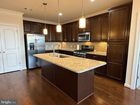 Photo of 13722 Neil Armstrong Avenue #407, HERNDON, VA 20171 (MLS # VAFX2295118)