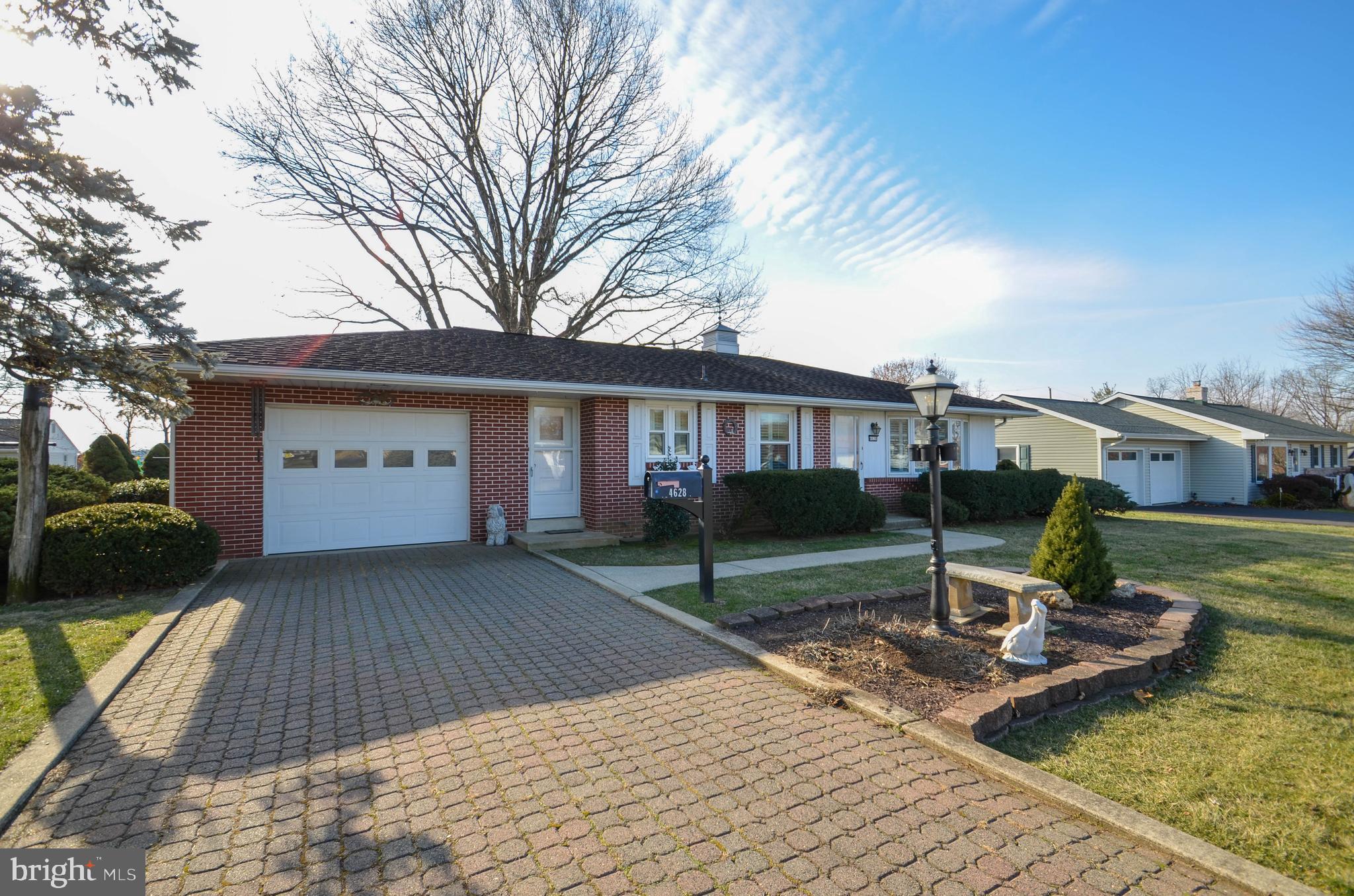 HIGHEST AND BEST due Sunday Jan 12th at 8pm with answer on Monday Jan 13th. Lovingly maintained by the original owner, this delightful ranch home offers a blend of comfort and style. Enjoy professionally refinished hardwood flooring in the living room and bedrooms, complemented by brand-new flooring in the dining area and kitchen. Abundant natural light pours through the large bay window in the welcoming living room, enhanced by interior wooden shutters on all windows. The open dining and kitchen layout is perfect for everyday living or entertaining, while down the hall, you’ll find two spacious bedrooms with double closets and a full hallway bathroom. The expansive basement provides ample storage, a newer water heater, a heat-pump and a washer and dryer. The home is equipped with a two-system generator setup (Kohler and Honda), capable of fully powering the house during outages, offering peace of mind year-round. Outdoor living shines with a covered and uncovered patio in the backyard, a large storage shed, and a paver driveway leading to an oversized one-car garage with additional storage. Nestled on a peaceful no-outlet street, the home is just minutes from schools, parks, and major routes including 309, 22, 78, and I-476. Don’t miss the opportunity to make this lovingly cared-for home your own!