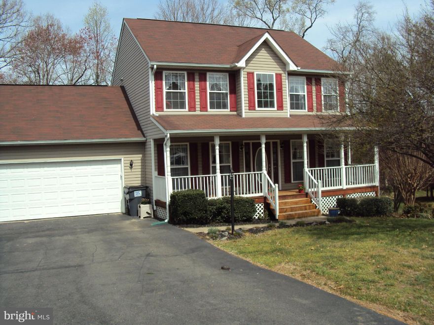 Lovely colonial in Lancaster Gate. Country front porch, 2 story foyer, hrdwd flrs, separate LR & DR. Kit/ FR combo walks out to large deck overlooking fenced yard backs to woods. Kitchen has new appliances, 2 large pantries, granite counter tops. Master bedroom w/ tray ceiling. Master bath w/ granite double vanity. Full finished bsmt w/ bonus room & full bath walks out to patio. Oversize garage.