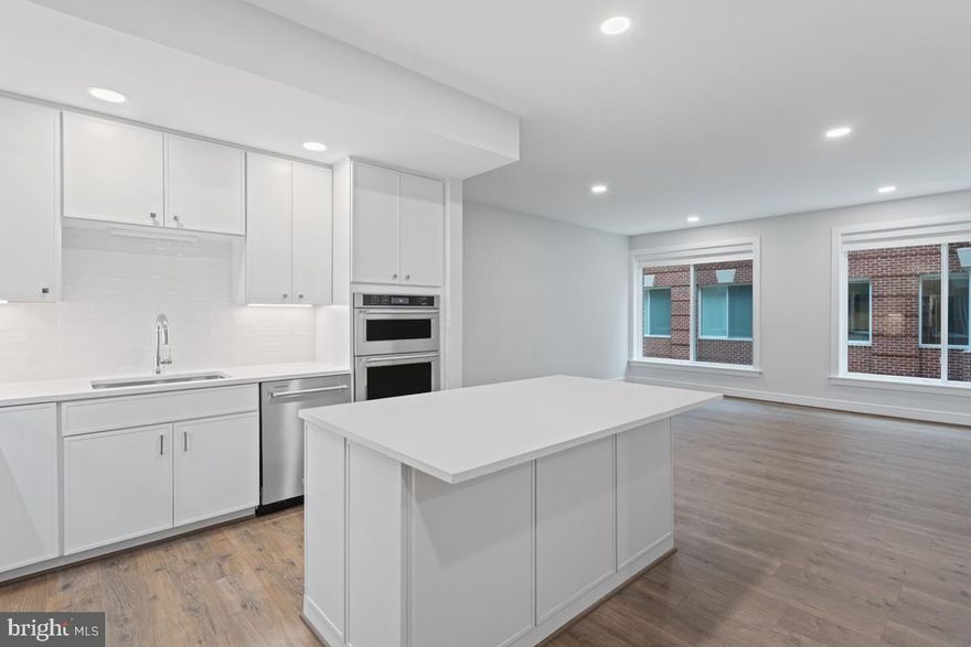 Ready for Move In!! New, stunning 2 bedroom, 2 bathroom condominium residence near the heart of Old Town Alexandria.
Spacious and contemporary flowing floorplan with a plethora of modern finishes and smart home technology! Croft Oak Rust 7" wide plank flooring span the entire home. The kitchen is ready for your creations, complete with state-of-the-art KitchenAid Stainless Steel Appliances and Micro Shaker White Cabinets which complement the Carrara Morro Quartz Countertops and White Subway Tile backsplash. Stand at the island and look out the living room full of natural light.  3 circular balconies are perfect to relax with your preferred beverage! Both bathrooms offer Blanc White Glacier Matte Tile floors and Stellar White Quartz countertops.  Full size washer and dryer complete this perfect home.
Towngate North has it all! Fitness studio with yoga room, furnished conference space, clubroom, bike storage and repair room, concierge and even a dog spa! Plus grill on the rooftop terrace while enjoying the views of the DC skyline and Potomac River! 
Towngate North's location will also exceed expectations.  Not only is there quick access to major thoroughfares, but just step outside to the Mount Vernon Trail, numerous local parks, restaurants, boutiques and historical landmarks plus walking distance to the metro and just a few miles from Washington DC, National Harbor and Ronald Reagan Airport. Its all here at Towngate North, ready for you to call home!