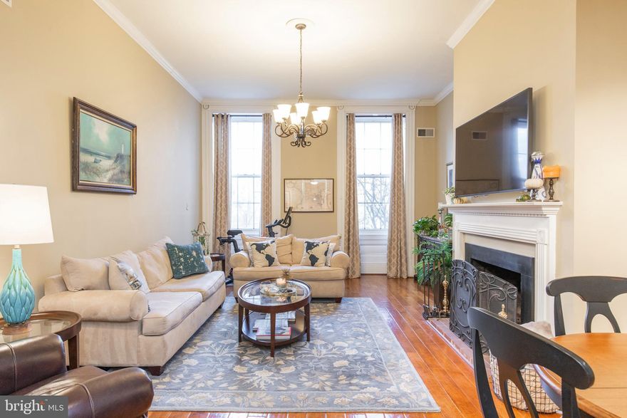 Welcome to 924 Spruce Street, Unit 201. This exquisite two-bedroom, one-bath condo seamlessly blends historic charm with modern amenities. Located on the second floor of a boutique brownstone building, this property features soaring ceilings and light-filled spaces. This unique home offers hardwood floors throughout, expansive windows, historic moldings and a rare wood-burning fireplace adding quaintness to a grand space. The chef's kitchen features a Viking range, Subzero refrigerator, ample cabinetry and counter space and a bonus area perfect for a coffee or wine bar. The large main bedroom is rear facing offering a quiet respite from city life. The second bedroom is located on the opposite side of the unit adding additional privacy. The recently renovated bathroom houses a stacked washer/dryer. The Washington Square West location has a walk score of 99 making city living easy and accessible. This home is within minutes to destination restaurants, local boutiques and shopping experiences, Whole Foods market and proximate to Jefferson University, Penn Hospital systems and Center City amenities. Just steps from green space at Washington Square park and historic attractions at Independence Hall, this property's central location puts it in the heart of Philadelphia and makes commuting in or out of the city effortless via I-95 or 676. Life in this quintessential Philadelphia neighborhood is unmatched and this unique condo provides a special home in the center of it all.