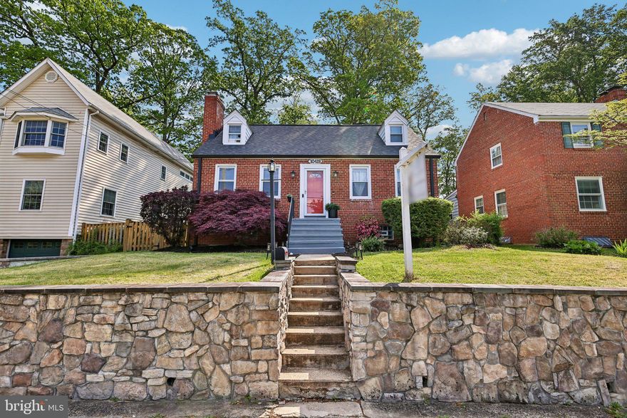 Charming Cape Cod in the sought-after Cameron Heights neighborhood of Silver Spring! This spacious 4-bedroom home features tons of natural light, gleaming hardwood floors on the main and upper levels, a welcoming living room with fireplace, and an updated kitchen with stainless steel appliances and quartz countertops. A large rear addition offers a bright dining room with new luxury vinyl flooring —perfect for everyday living and entertaining. Enjoy the expansive fenced backyard from the oversized deck with added privacy fencing. The home includes 2 updated full baths, including an upper-level primary suite. The finished lower level features a large recreation room with LVP flooring and recessed lighting, plus a walk-out utility area with laundry, storage, and workshop space. Recent updates include a brand-new roof (2025) and freshly painted front porch enhancing the home’s curb appeal. Conveniently located near Forest Glen Metro, Georgia Ave, US 29, and I-495, plus shopping, dining, and major commuter routes with easy access to DC and Baltimore. Don’t miss this move-in ready gem!