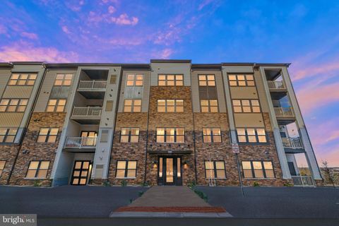 Photo of 46294 Mount Milstead Terrace #400, STERLING, VA 20164 (MLS # VALO2119678)