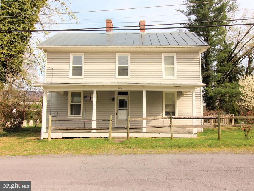 Great farmhouse in town.  Replacement windows (within 2 yrs), newer metal roof (partial), furnace (4-5yrs) and newer hot water heater.  One main level bedroom and 3-4 bedrooms upstairs. (two without closets). Very spacious, enjoy the front porch and side porch and the large deck on the other side. Sold "AS IS, WHERE IS".