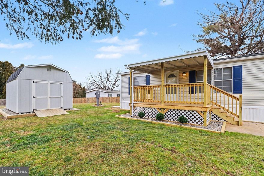 Welcome to 8 Kimberly Ave in Heritage Estates - a thoughtfully maintained 3-bed, 2-bath doublewide situated on a lovely, open lot. As you approach the home, you'll immediately notice the brand-new covered deck, perfectly complemented by classy landscaping that enhances the home's curb appeal. Step inside to find an open and inviting kitchen and main living area, ideal for both everyday living and entertaining. The kitchen features new upper cabinetry, a new stove, a new built-in microwave, and a pantry.
The spacious primary suite includes a walk-in closet and a walk-in shower. Two additional bedrooms and a second full bathroom provide plenty of space for family, guests, or a home office. An extra-large shed in excellent condition is included in the sale, providing ample additional storage. As a bonus, this home is equipped with central air, added just five years ago, and a propane furnace that was replaced last year. Enjoy affordable living with low property taxes of just $293 per year and approximate land rent of $525/month. Don't miss this opportunity to own a move-in ready home with modern updates, generous storage, and a fantastic outdoor setting.