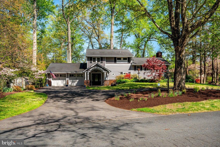 Tucked along Church Creek, just off the South River, 26 Wilelinor Drive offers a rare blend of convenience, privacy, space, and meaningful waterfront living. Set on nearly an acre (.8642 acres), this property pairs a thoughtfully renovated home with a deeded dock featuring two slips, with the pier resurfaced, one slip offering a floating dock for easy water access and the other recently dredged.  Originally built in 1960 and extensively renovated in 2013 and 2015, the home spans four levels with four bedrooms and two and a half bathrooms. Three bedrooms are located on the top floor, with the fourth bedroom and a dedicated office space on the lowest level.  The entryway opens into the level featuring a family room and game area, along with access to the back patio. From there, the main living level features an open-concept layout centered on a bright kitchen with updated granite countertops, an oversized 62" x 80" island, built-ins, pot filler, gas cooking, and stainless steel appliances. The main living room offers extensive natural light, access to the back patio, and water views.  Two fireplaces, one wood stove and one gas, provide additional heat.  The backyard is a true extension of the home, with newer hardscaping and extensive landscaping completed over the years, creating a setting that feels more like a private park.  The property includes a new drain field (2025), updated gutters and drainage systems, and major mechanical updates including HVAC, water heater (2024), and a whole-house generator with an automatic transfer switch.  An oversized two-car garage with a third door for drive-through access to the backyard, a circular driveway, side driveway for additional parking, and a 12' x 18' shed provide storage and parking flexibility. The backyard also includes a compost station and a large kayak rack.  The shoreline has been reinforced with new pilings and deadheads. Additional features include smart home hubs (two hubs and a dot) and a programmable thermostat.  Wilelinor Estates is one of Edgewater’s most distinctive waterfront communities, quietly set apart, yet minutes to Annapolis. Known for its wide streets, mature trees, and access to Church Creek, the South River, and beyond, the neighborhood offers a waterfront clubhouse, boat slips, a kayak and paddleboard launch and racks, and trails along several ponds. Life here centers around the water, the outdoors, and a sense of space that’s increasingly hard to find.