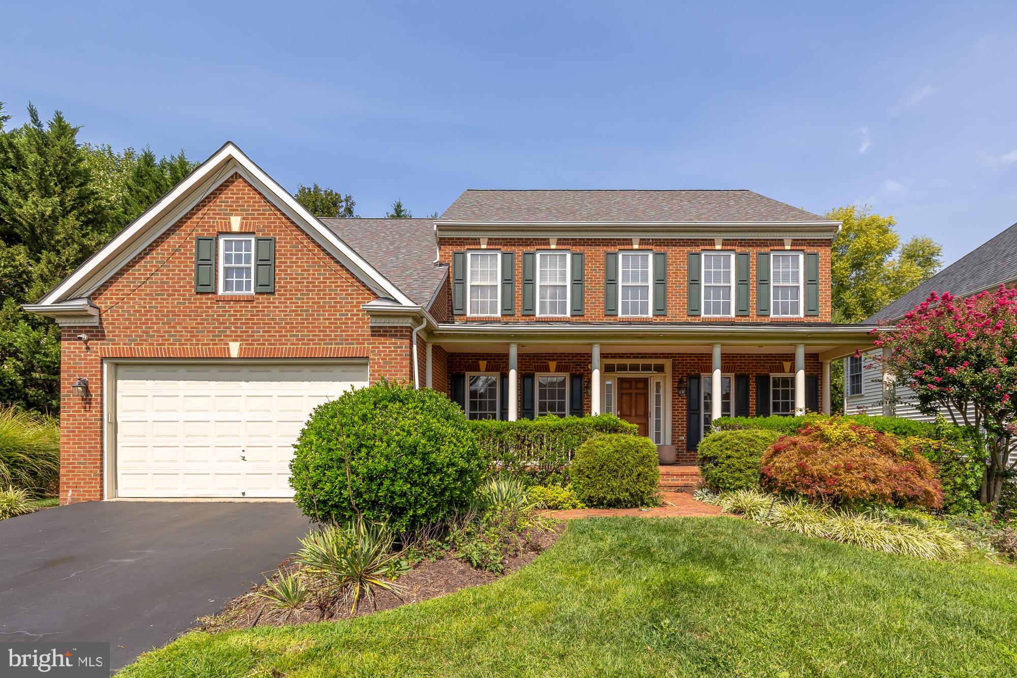 Gorgeous three-level brick residence situated in a peaceful cul de sac! Cross over the idyllic front porch and into the grand foyer, where you’ll discover gleaming hardwood floors and a sweeping staircase. To your right, the elegant living room features crown molding and floor-to-ceiling windows. The adjacent formal dining room, with sophisticated chair rail molding, has plenty of space for large family gatherings or intimate dinner parties. Continue into the spacious eat-in kitchen, where you’ll find sleek granite countertops and stainless steel appliances, including a double wall oven and smart refrigerator. Pull a stool up to the oversized island bar or enjoy a casual meal in the light-filled breakfast nook. A gorgeous wall of windows floods the family room with natural lighting, the perfect space to get cozy by the gas fireplace. On the other side of the home, the bright and airy home office includes recessed lighting and beautiful built-in shelves. Upstairs, your luxurious primary bedroom retreat boasts a magnificent tray ceiling, plush carpeted floors, two large walk-in closets, and its own private sitting area. The handsome en suite bathroom includes two separate vanities, corner soaking tub, and a step-in shower with seat. Not to be outdone, the secondary bedroom features an attached full bathroom of its own, making it a great private guest space. Two additional bedrooms are both sizable with wide closets, ceiling fans, and a shared full bathroom in the hall. The lower level offers a secondary living space with soft carpeting and recessed lighting. Have all of your friends over to watch the big game in the soundproofed recreation room with a full bar for serving snacks! The fifth private bedroom and third bright full bathroom round out the lower level of the home. Walk outside from the lower level and enjoy your peaceful surroundings! Large mature trees provide both privacy and shade while you relax on your wooden deck off the kitchen or play in your lush backyard. On the front of the home, the two-car garage and long driveway offer an abundance of space for storage and parking. This peaceful community is located just minutes to Safeway, Giant, Walmart, Target, Kingstowne Towne Center, Old Town Alexandria, Springfield Town Center, Hoffman Center, and Loftridge Park. Commute easily with Eisenhower, Van Dorn, Huntington, and King Street Metro Stations all nearby! Quick access to I-495, Van Dorn Street, Duke Street, and I-395. Schedule a private tour of your gorgeous new home today! Lower HVAC - 2012. Upper Level HVAC - 2022. Water Heater- 2021. Roof - 2024.