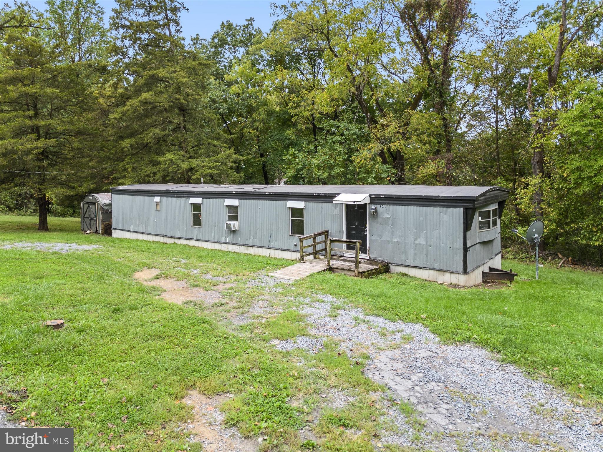 This 3-bedroom, 1 full bath single-wide trailer is situated on a cleared and spacious .76 acres of land, backing to trees for privacy. It presents a prime investment opportunity in Harpers Ferry, with a strong rental history, generating $1350 per month. This property can be a reliable source of income and a valuable addition to any investor's portfolio. Public water and a private septic, so water & electric are the only utility bills. The layout includes an eat-in kitchen, living room, three bedrooms that share a large bathroom with a tub/shower combo, and laundry area. Come see it's potential! All this, just a few minutes from the Loudoun County line, MD state line and short commutes to Leesburg or Frederick.