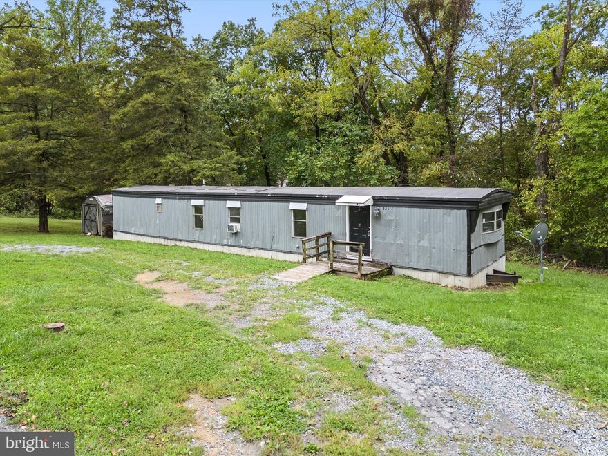This 3-bedroom, 1 full bath single-wide trailer is situated on a cleared and spacious .76 acres of land, backing to trees for privacy. It presents a prime investment opportunity in Harpers Ferry, with a strong rental history, generating $1350 per month. This property can be a reliable source of income and a valuable addition to any investor's portfolio. Public water and a private septic, so water & electric are the only utility bills. The layout includes an eat-in kitchen, living room, three bedrooms that share a large bathroom with a tub/shower combo, and laundry area. Come see  it's potential! All this, just a few minutes from the Loudoun County line, MD state line and short commutes to Leesburg or Frederick.
