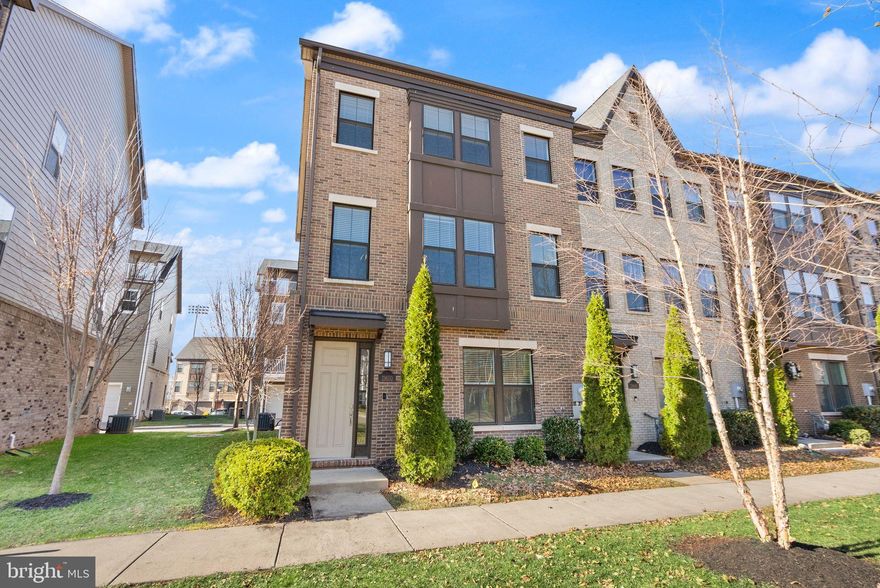 Welcome to this stunning end-unit in Herndon! This spacious 2018 townhome in Discovery Square comes to the market in pristine condition and will have you feel like you are moving into a brand new house!  Fully refreshed with brand new paint throughout and all new carpet, this home is absolutely turnkey and has everything that you are looking for.   Spanning 4 levels and just under 2900 square feet, the space is just incredible.  The main level features a massive main living area complete with a lovely fireplace and built-in shelves. You'll also enjoy the beautiful center kitchen that's equipped with striking dark cabinetry, an oversized center island, quartz countertops, and a pantry!  There's also plenty of room in the formal dining area - enjoy meals here with a large dining set, or at the kitchen island with barstools!  This level is also home to a half bathroom that's nicely tucked away for privacy. Upstairs you'll find the bedroom level that's equipped with 3 spacious bedrooms and 2 full bathrooms, including a wonder primary suite. The bedroom itself has all the room you could need, a lovely primary bathroom with a double vanity and shower, and a full walk-in closet!  The other 2 bedrooms share a bathroom with a large vanity, and you've got the laundry room on this level too - very convenient!  The 4th level features a fantastic loft with vaulted ceilings, a half bathroom, storage closet, and plenty of room for activities. Plus, you'll enjoy a nice terrace up here too!  The lower level is home to another large recreation space that could be enjoyed as-is or easily walled off to make a 4th legal bedroom suite.  This level is also home to the oversized 2 car garage - unlike most garages, this one can house 2 SUVs with ease, which is a true game changer!  The home also comes equipped with smart features, so you can easily get plugged in with the wifi boosters, wire in your own security system, connect to door locks, and more. As for schools, this one feeds to the Westfield High School pyramid! The icing on the cake is the location - you're just a short drive  from metro stations, the Reston Town Center, Tysons Corner, Dulles Airport, major commuter routes and highways, and everything Northern Virginia has to offer.  Be sure to come see it for yourself!