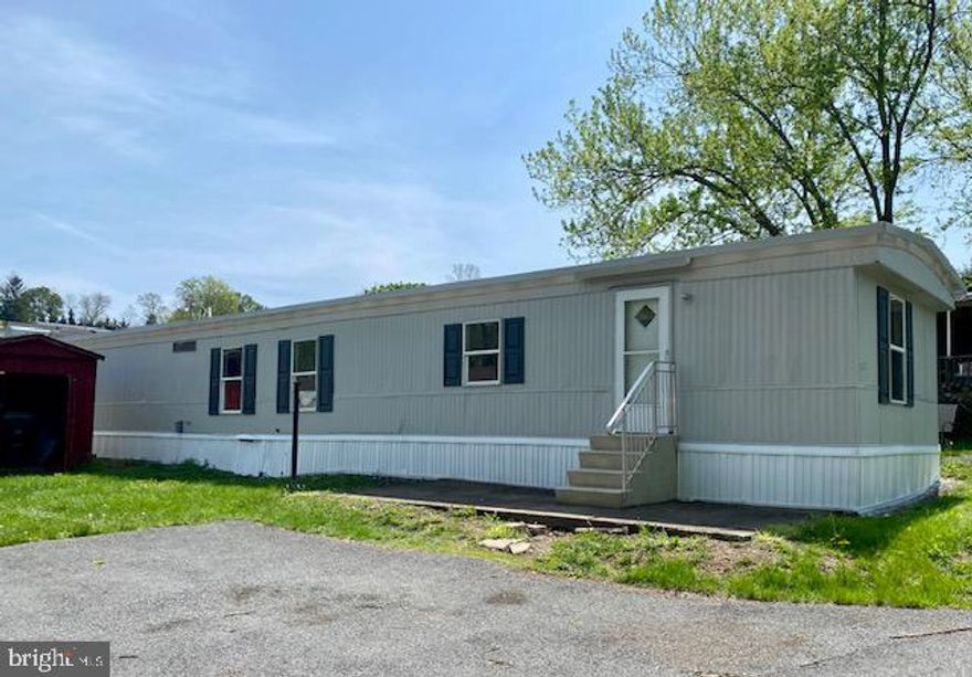 New price!  Enjoy inexpensive living in this newly updated  3 bedroom, 1 bath, 1985 Peerless single wide mobile home. Outdoor shed for extra storage. Brand new flooring and paint throughout! Propane heat and electric stove. All appliances, including washer and dryer, stay!   Come check this out today and be in by the Holidays!  (Note:  Lot rent is $488.91/month and includes sewer and trash service)