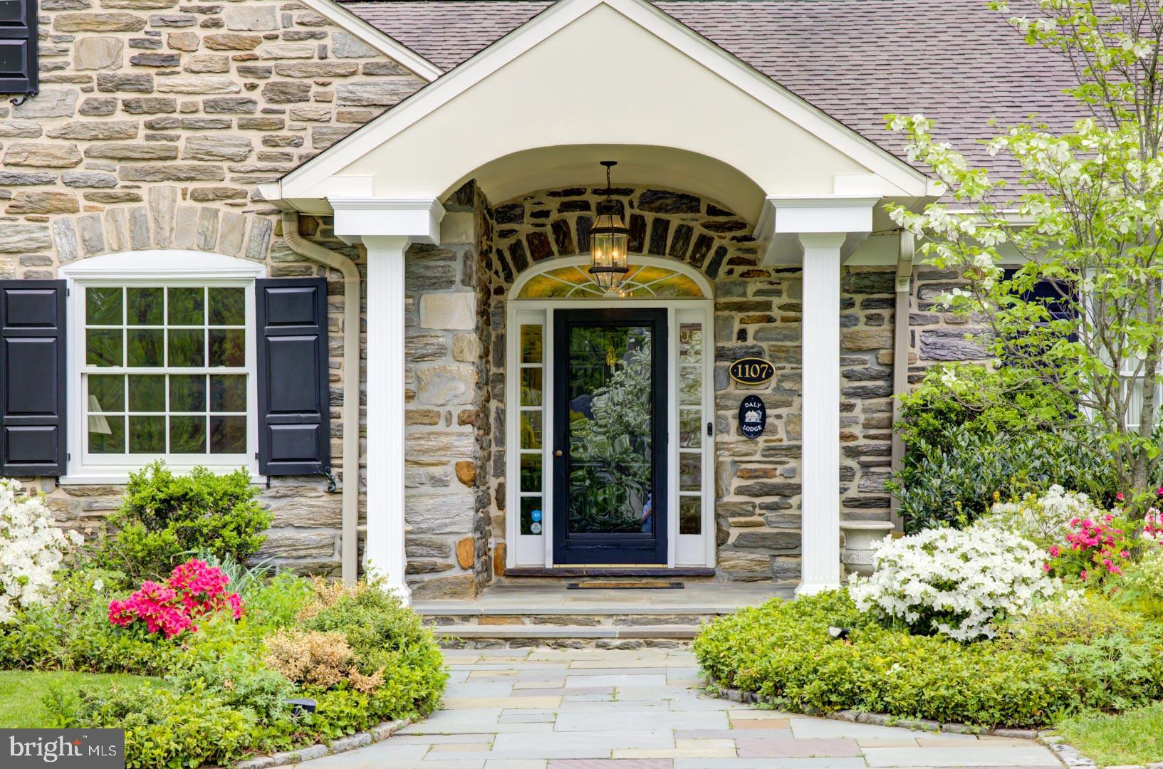 Welcome to 1107 Robin Road located in desirable Gladwyne just minutes from all the Main Line has to offer! This delightful property resides on a beautiful level, professionally landscaped lot with mature plantings at every sightline. A secluded gardener's delight with gorgeous fieldstone patio w/Outdoor Kitchen, simply designed/serene Pool with Changing or Storage Cottage, lovely Lawn Space for additional grassy seating provides everything for sparkling entertainment or quiet, relaxing evenings. This desirable property offers the best of outdoor living with great flow entrances to a Gorgeous Cape Cod Home. The Main Entrance offers a Half-Moon Drive with Oversized Entry Door to greet all. The Main Floor provides a Traditional Living Room w/Oversized Window with perfect view of the front landscape & Gas Fireplace; a Formal Dining Room with Floor to Ceiling Window-scape allowing for an abundance of Light & Views of the spacious patio w/colorful gardens; Off the Dining Room sits a Study Room/Office with a bright corner exposure and access to the Two Car Garage with ample storage; the Kitchen features GE Monogram/Profile Appliances, Wine Cooler, a perfect working Area & Island for the Chef, along with opening to Dining Area/ Gas Fireplace/Family Room for all; the Laundry, with plenty of storage, is just off the kitchen for all the day-to-day necessities; the Formal Foyer offers a desirable entrance with a Powder Room; the Main Bedroom is just off the Hallway with a spacious Bath w/Single Standing Double Vanities, Jacuzzi Tub, Rain Shower and Bright Sunlight-Lovely; another Bedroom w/Full Guest Bath with Tub/Shower combination completes this floor. The Upper Level of this accommodating home is accessed by a Turn Staircase just steps from the Foyer; two Airy and Open Bedrooms flank a Beautiful Hall Bath with Vanity, Tub/Shower Combination; a Hallway leading to the Third Bedroom provides Storage Shelving, Storage Cedar Closet and a Simply Fabulous oversized Bedroom complete with Shelving and Full, Luxurious Bath w/Stall Shower & Vanity-a perfect Main Suite or Guest Suite-a Hidden Gem. The lower level of this pleasing home offers a wonderful Playroom/Wine Closet and Large Storage Area for all those little extras. Don’t miss this opportunity to visit today and enjoy!