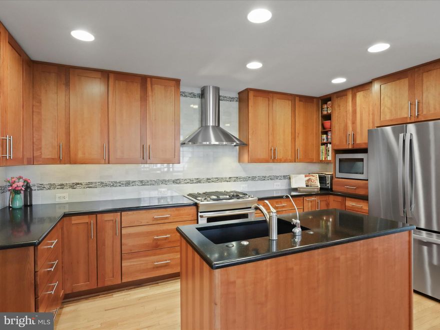 Prime Location & Incredible Features Await You!

This charming home is ideally located just a short 10-12 minute walk to Ballston Metro, offering easy access to the heart of Arlington and beyond. Enjoy the convenience of being within walking distance to the bike trails, vibrant shops, and a variety of dining options. Nestled on a quiet, peaceful street, the home is located within the Washington-Liberty High School district.

The fabulous lot boasts a spacious, relatively flat yard that provides a perfect outdoor oasis. With a welcoming front porch, a sunny rear deck, and a screened porch, you will find plenty of space to relax and entertain in this peaceful setting.

Inside, the home is flooded with natural light, featuring high ceilings, an open floor plan, and skylights. Beautiful hardwood floors throughout most of the main level add warmth and character to the space. The main floor also includes a bedroom with an adjacent full bath, making it an ideal option for guests or multi-generational living. The living room area includes a gas-ready wood-burning fireplace open to the sunny dining area all washed with natural light from the two story ceilings, beautiful windows, and skylights.  The adjacent family room can be separated by glass pocket doors with built in shades for privacy.  Enjoy the designer ceiling fan and sliding glass doors, which leads to the backyard or screened porch, providing a seamless flow between indoor and outdoor living.

The kitchen, renovated in 2010, is a chef’s dream, featuring upgraded custom cabinetry with pull-out shelving, a center island, stainless steel appliances, and a large sink.  There is a touch of Frank Lloyd Wright flair in the glass cabinetry.   A separate filtered water dispenser adds a thoughtful touch for added convenience. 

Upstairs, the home offers three spacious bedrooms, including a primary suite with high ceilings, a private balcony overlooking the rear yard, a built-in laundry hamper, and a walk-in closet. The primary bathroom is beautifully appointed with skylights. Two additional bedrooms are connected by a Jack-and-Jill bath, and the bedroom level also includes convenient laundry and access to the attic for additional storage.

The finished lower level provides a large second family room, with white bookshelves and cabinetry that will convey. This space is perfect for relaxing or hosting guests, with a potential bonus room that could serve as an exercise room, home office, or playroom. Additional features include a second refrigerator, ample storage, and a built-in workbench.

Truly an outdoor oasis, step into the exquisitely  landscaped, partially fenced rear yard, where you can enjoy outdoor living to the fullest. An incredible rolling bloom of flowers and foliage for you to enjoy from the deck, porch, or balcony.   A plumbed gas grill is available and can convey, making it easy to entertain friends and family.  

The oversized two-car garage offers plenty of space, complete with tall finished attic storage, pull-down stairs, plumbing, and electricity.  Perhaps it could be a potential ADU?

This home has been meticulously maintained, with a freshly painted exterior (2024), a new roof and skylights(2019), HVAC (2014), and a water heater (2016), ensuring peace of mind for years to come. Don’t miss out on this exceptional opportunity to own a home in a prime location with incredible amenities. 

Open Saturday and Sunday 11-1

Seller would like to be in the home through June 1st if possible.