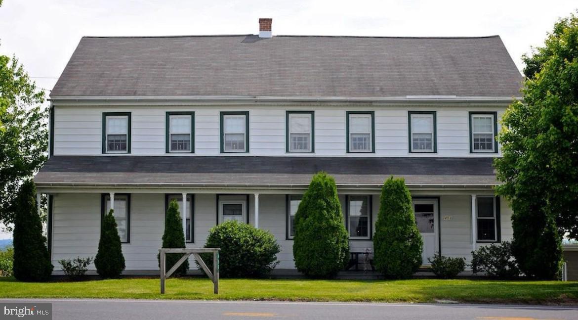 This property will be offered at Public Auction on Friday, October 17, 2025 @ 6pm. The listing price is the opening bid only and in no way reflects the final sale price. 10% down due at auction, 2% transfer tax to be paid by the purchaser, real estate taxes prorated. This prominently located Manheim property, with fantastic income potential, boasts 9,500 square feet of storage and a two-story farmhouse with a private apartment. The main portion of the home hosts a generous living room, an eat in kitchen, a formal dining area, and a sun porch. Upstairs, you will find three bedrooms and a full bathroom. The adjoining apartment, complete with its own private entrance, separate electric meter, and individual mailing address, includes a living room, eat-in kitchen, and half bath on the main level, plus two bedrooms and a full bathroom upstairs. Outside, you’ll find a 42’ x 65’ barn with horse stalls and ample storage, as well as a 40’ x 116’ garage. Additional amenities include two separate 1-car garages beneath the farmhouse, a spacious yard, and convenient access to shopping centers, restaurants, and Routes 772 & 72. Don’t miss this rare opportunity in Penn Township!