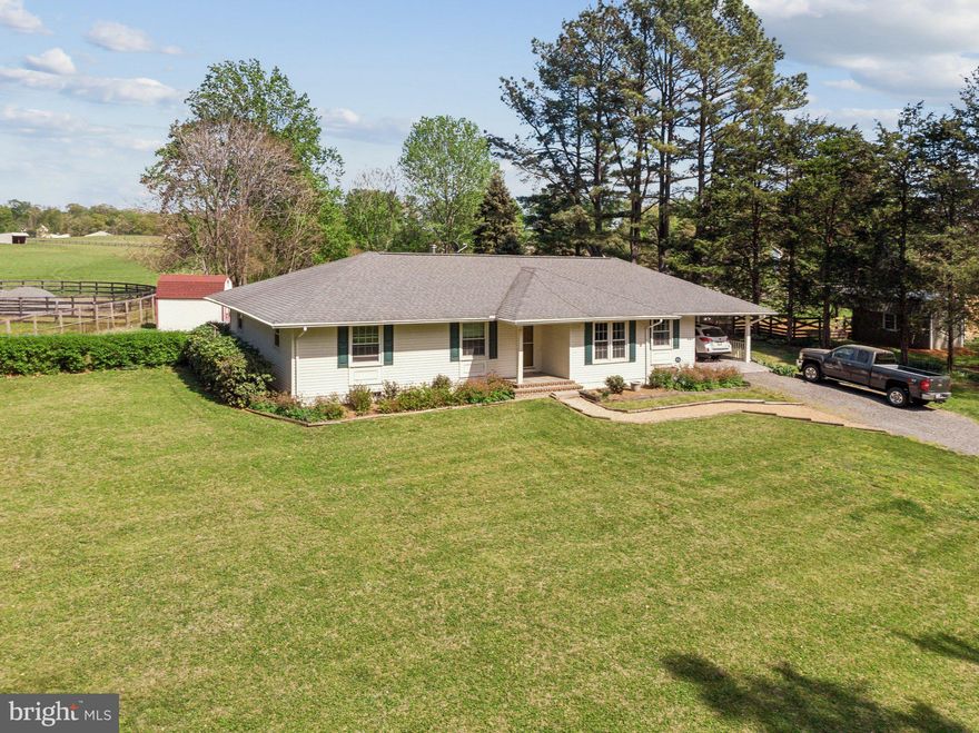 Tucked quietly on just over an acre in the picturesque Opal-Fauquier Springs-Warrenton corridor, this charming home is a haven for those seeking a more tranquil lifestyle without giving up convenient access to city amenities. Just minutes from Route 29, you're effortlessly connected to Warrenton and Northern Virginia, yet surrounded by the peaceful rhythms of countryside living.

As you arrive, you're greeted by a welcoming stamped concrete carport—ideal for covered parking or an outdoor seating area. Step inside and discover a thoughtfully updated home with a warm, inviting feel. The kitchen, beautifully renovated in 2018, features granite countertops, modern cabinetry, and upgraded 
appliances. A large walk-in pantry and abundant closet space blend practicality with everyday comfort.

The heart of the home is the spacious family room, complete with a cozy wood stove—a perfect spot to unwind on cooler evenings. Large windows throughout the home frame views of the surrounding greenery.

Out back, a stamped concrete patio opens to a beautifully fenced backyard, where a shed offers additional storage and the lush landscape invites you to garden, relax, or simply soak in the serenity. Whether you're enjoying your morning coffee under the trees or hosting summer gatherings under the stars, this yard is designed to be your personal retreat.

Lovingly maintained by the owner, this home is more than a place to live—it's a setting for life’s cherished moments. Now, it’s ready to welcome its next chapter and new memories.