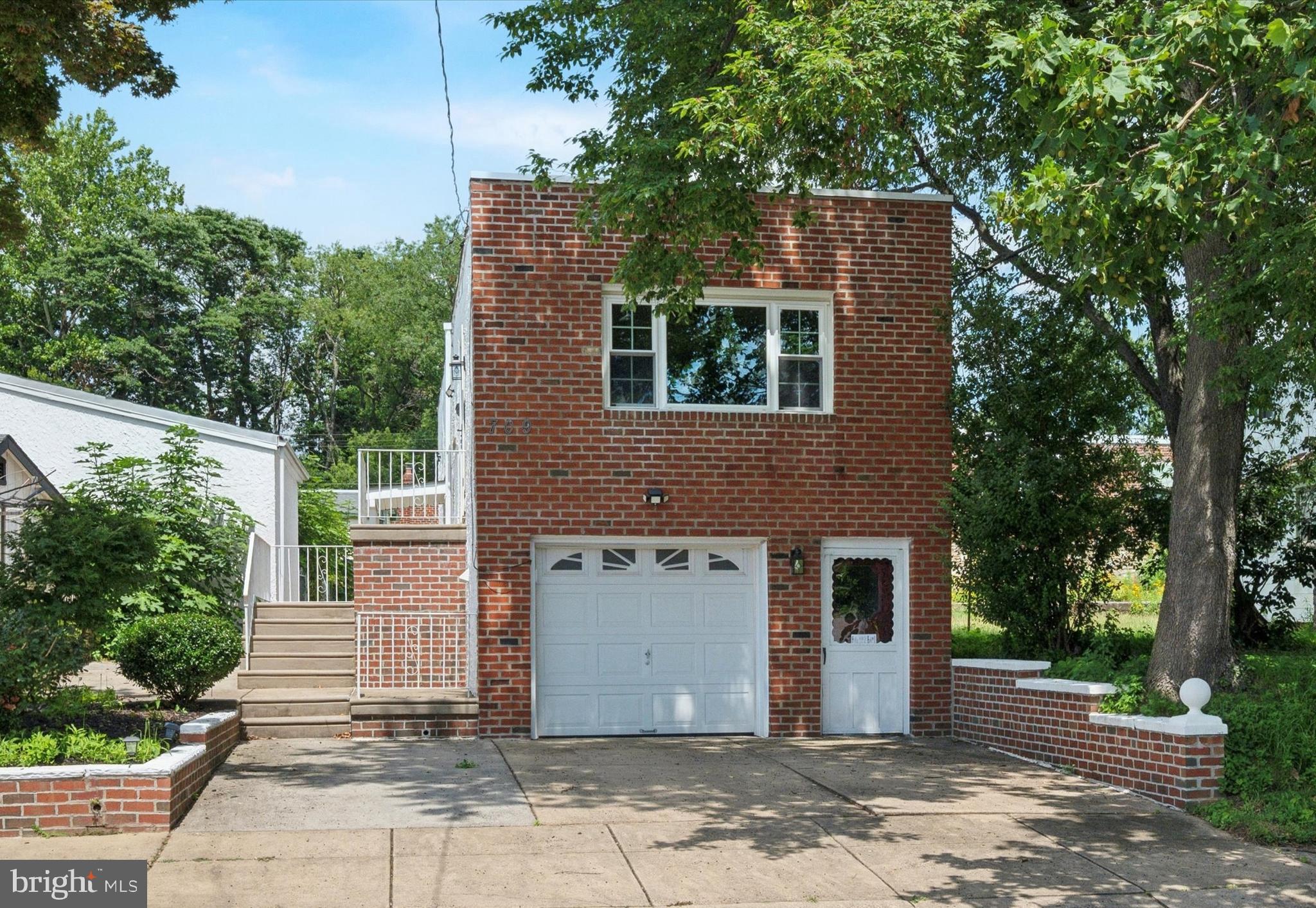 Welcome to 709 Chandler Street, a newly renovated, detached home on a quiet tree-lined block in Fox Chase. This one-story home (with a finished lower level) features 3-bedrooms (or two bedrooms plus a lower-level bonus room), 2-baths, new wood floors throughout, and great natural light. Plus a garage and spacious driveway with room for 3 car parking and two nice outdoor spaces. This home has flexible space that is ideal for live-work and so many other uses.
The home has been recently renovated with a new roof, electric, and plumbing, new windows and central air and heat. The finished lower level is carpeted with a separate entrance, so it makes a perfect work-from home space, artist studio, office, playroom, or additional living space. It has a full bath and could also be an in-law suite (note that bedroom does not have a second egress).
As you enter the home, you’ll be greeted by an open living space with a large front window and a brand-new electric fireplace and hard wood floors. The living room is open to the kitchen, and here you will find new cabinets with ample storage, and all brand-new appliances including a refrigerator, oven, dishwasher, microwave, and garbage disposal. The large island connecting the living room and kitchen gives you enough space to cook and entertain and there is even a pot filler located over the stovetop. Outside the kitchen entrance, you will find enough space for a dining table and more cabinets for storage.
In the hallway connecting the dining area to the bathroom and bedrooms, you’ll find a laundry chute that makes doing laundry a breeze! Further down the hall, you’ll find 2 spacious bedrooms, both with ample closet space, as well as a fully renovated hall bathroom.
The exterior offers a side yard and patio that leads to the rear yard. The side patio is perfect for entertaining and even has a large fig tree. To the side you will find the driveway, garage door, and entrance to the lower level. The lower level has an extra refrigerator and electric oven range for your convenience. The lower level houses the laundry room with a new washer/dryer and utility sink, a renovated bathroom, another living space, and a mechanical room. The mechanical room has another door for entrance/exit and leads to the side patio. This lower level is very versatile with 2 separate private entrances and would make for a great work-from-home office, in-law suite, playroom, bedroom, or living space.
Ideally located near grocery stores, parks, a recreation center, major highways, and just a half mile from Septa regional rail line.