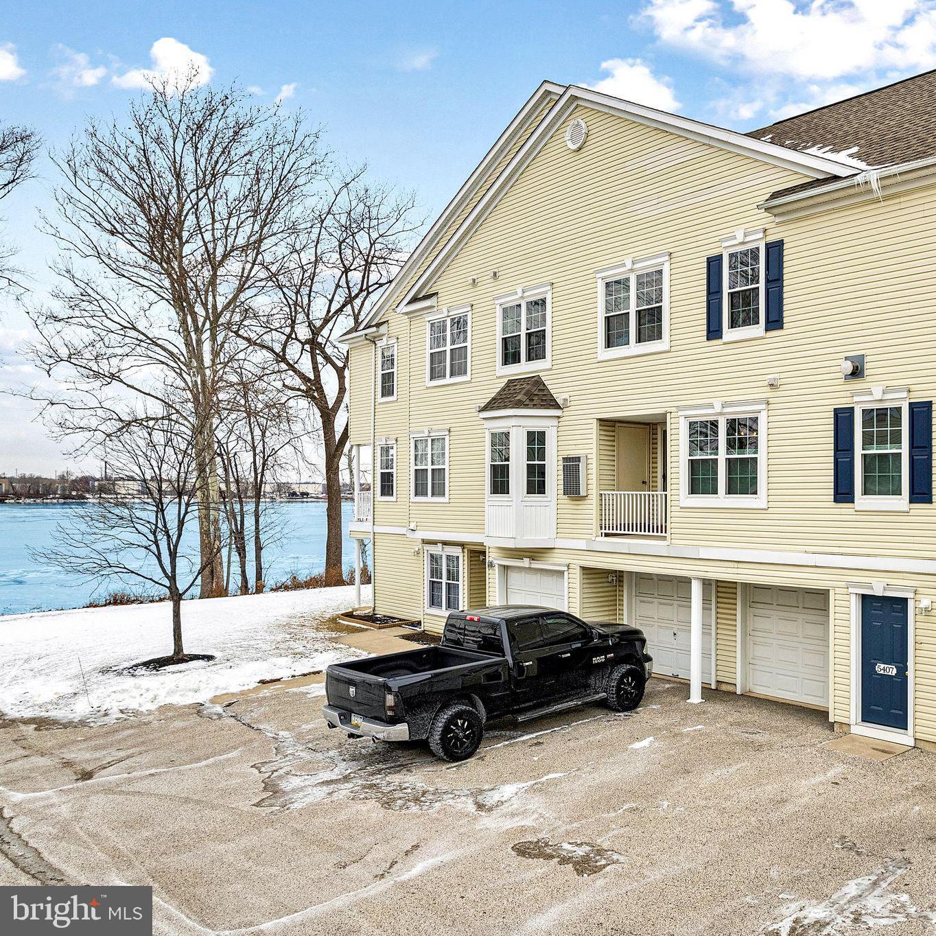 Location, Luxury, and Stunning Views – This rarely available, larger Riverfront community model home offers spectacular panoramic views of the river, bridge, and mesmerizing sunsets, all from the comfort of your home or deck. The pristine interior is flooded with natural light by day and glows with the twinkling lights of the city across the river by night. Thoughtfully updated and meticulously maintained, this home showcases pride of ownership throughout.The main level features open and spacious rooms, including a bright living room and dining area with gleaming hardwood floors and a cozy two-sided fireplace that adds both warmth and elegance. The updated kitchen boasts ample cabinet and counter space, complemented by high-end newer JennAir stainless steel appliances and a brand-new Bosch refrigerator. A conveniently located laundry room completes the main floor.Upstairs, the generously sized primary bedroom is a true retreat, with vaulted ceilings and more breathtaking river views. The en-suite bath offers a luxurious jetted tub, a separate shower stall, and a vanity. Two additional well-sized bedrooms and another full bath round out the upper level.Recent updates include new double-hung windows (2021), a new HVAC system (2023), a new roof (2015), and an epoxy-coated garage floor, along with newer insulated garage and entry doors. The list of improvements goes on!This sought-after community offers top-tier amenities, including a fitness center, bike and walking paths along the river, Fishing and kayaking right off the front beach, there are 2 ponds that are home to some of the local birds, turtles and ducklings. Sit on the beach and catch the display of colorful fireworks across the river on holidays. The easy access to Riverton's renowned yacht club and historic homes district add for scenic strolls. Enjoy the best of leisure living with dining, shopping, and outdoor recreation just minutes away. The nearby Nature Cove and Amico Island are perfect for outdoor nature lovers activities, while Philadelphia's historic districts and trendy spots are just a short drive away.