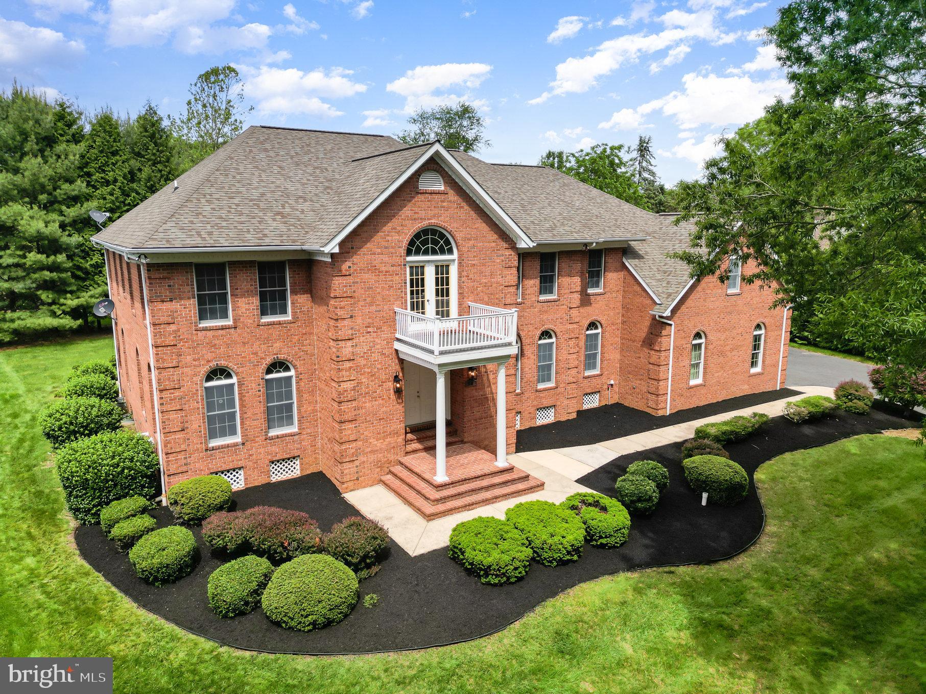 Welcome to 1012 Glenangus Drive, a custom all-brick estate with more than 7,000 finished square feet of living space. Situated on a premium half-acre lot with breathtaking views of the prestigious Maryland Golf and Country Club golf course, this one-of-a-kind home showcases exceptional architectural design with 2x6 construction, grand dual staircases, and soaring ceilings. The heart of the home features a gourmet kitchen with a walk-in pantry, breakfast room, and beverage bar, opening to a stunning two-story family room with a custom brick fireplace. You'll find hardwood floors that flow into the additional main level living spaces - an office, living room and dining room. Retreat to the expansive primary suite with a private sitting room, spa-inspired bath, and skylit jacuzzi room. There is a loft as well as three more upper level bedrooms and two more full bathrooms to complete the upper level. Ideal for entertaining, the finished lower level boasts a full bar, dance floor, media room, and potential in-law suite with a kitchenette and full bath. Additional highlights include: A grand entrance foyer; versatile recreational spaces; main-level laundry and mudroom; fresh, neutral paint and new carpet; new waterproofing system with transferable warranty; three-car sideload garage; and outdoor patio with a level lot backing to trees for privacy. This is more than a home—it's a lifestyle. Surrounded by million-dollar properties in one of the region’s most sought-after communities, this home is a must-see.