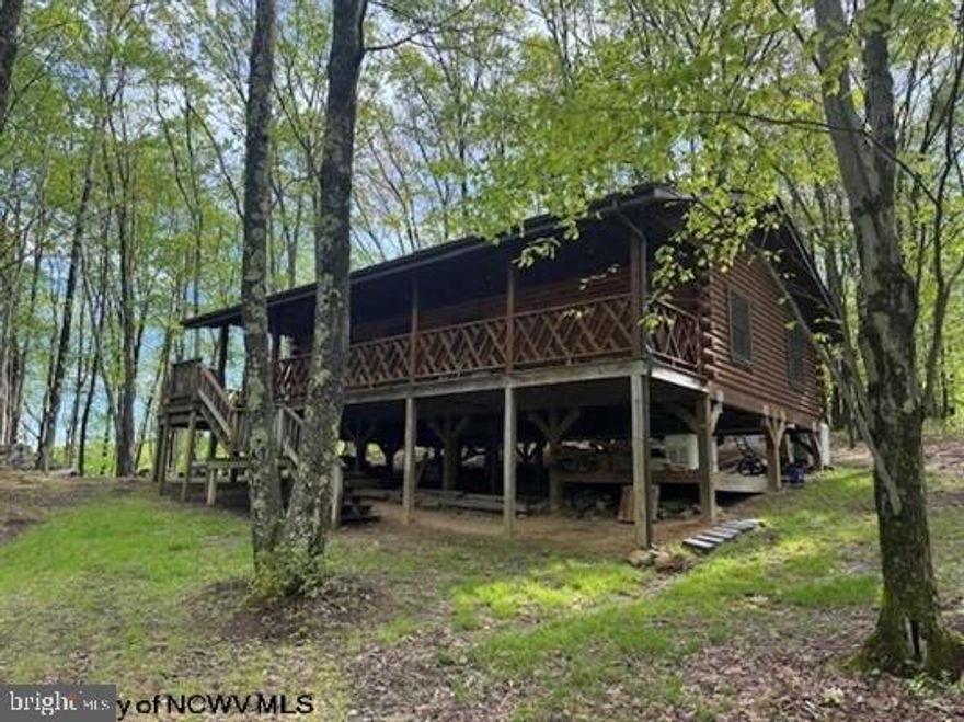 Welcome to your own slice of WV mountain paradise! Nestled on a breathtaking 34.4 acres of lush timberland, this charming 3-bedroom cabin is the ultimate retreat for nature lovers and anyone seeking a peaceful escape from the hustle and bustle of everyday life. Experience the perfect blend of rustic charm and modern comfort in this 40x24 3 bedroom 1.5 bath cabin, where every sunset paints the sky with vibrant hues, providing a picturesque backdrop to your tranquil lifestyle. Tucked away from all of the noise and distractions, this cabin offers the ultimate retreat for those seeking peace and quiet. Imagine sipping your morning coffee on the porch as you listen to the gentle rustle of leaves and the melodic sounds of nature surrounding you. The heart of the Appalachian Mountains is your backyard!  This property has immediate timber income with mature trees and healthy timberland, you could turn your investment into a sustainable income source while enjoying the benefits of nature.  Property is also conveniently located less than 1 hour from Morgantown and Bridgeport, 1/2 hour from Tygart Lake, 1 hour from Deep Creek Lake and 1 hour from Canaan Valley.  This is a must see!