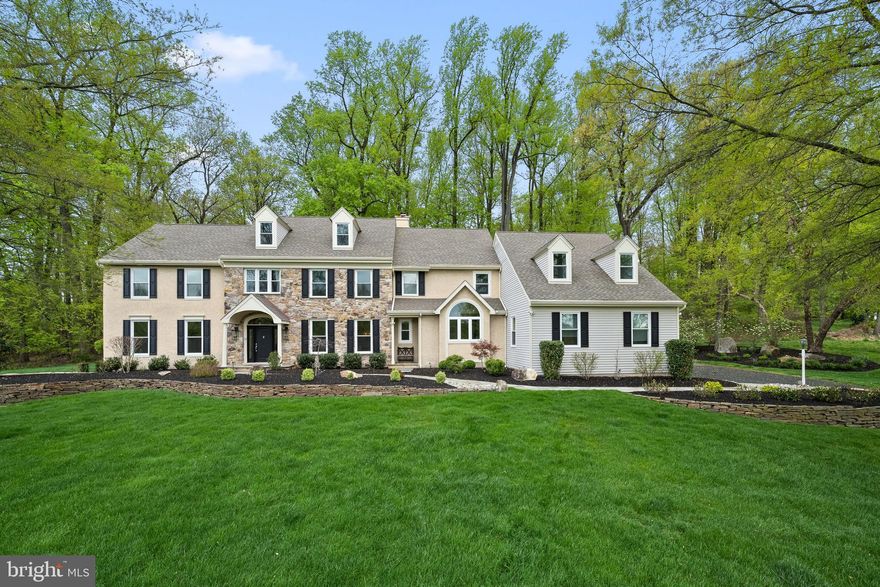 This luxurious estate manor home in the upscale community of "Whitehorse" in Malvern, on a premium, private cul-de-sac location with open space views is sure to impress. This tastefully appointed custom "Charlestown" model leaves no detail overlooked. This home boasts 3 levels of elegant living space including 5 bedrooms, 3 full baths, 3 powder rooms, and a finished lower level. No expense was spared with upgrades and improvements, including professionally landscaped grounds with a custom-designed patio, waterfalls, and a Koi Pond. The first floor features a grand front-to-back entry foyer, hardwood floors throughout, and large windows that drench each space with natural light and provide stunning views of the surrounding grounds. The formal living room and formal dining room are spacious with custom wainscoting and plenty of room for everyday living or entertaining guests. A first-floor office/study with custom built-ins creates a private space while you work. The gourmet kitchen features high-end appliances including a Subzero refrigerator, stainless steel double oven, 5-burner gas cooktop, and dishwasher. The kitchen also includes quartz countertops, a large walk-in pantry and a butler's pantry with glass front cabinetry that leads back to the dining room creating an easy flow. The separate breakfast/morning room includes a two-sided fireplace adjacent to a bright 2-story family room with full wall feature windows and access to a private backyard oasis with flagstone patio and gardens. A mudroom/laundry room off the kitchen offers entrances from the 3-car garage and backyard. Two powder rooms and a back staircase complete this level. The second floor offers a luxurious primary suite with a sitting room, custom closet, and a primary bath with an oversized glass shower, and a soaking tub. The four additional bedrooms are nicely sized with ample closet space and windows that provide warm natural light and lovely views. Two share a Jack & Jill bath and two share the hall bathroom. The multifunctional bonus room is ideal for an additional bedroom or kid's playroom, additional office, or anything that suits your needs. The expansive finished lower level is the ultimate casual entertaining area with a full sports bar, living area, two exercise rooms, a workshop, half bath, and storage room. The 3-car garage is fully outfitted with custom cabinetry, shelving storage systems, and an epoxy coated floor. Conveniently located near award-winning schools, major highways, and Paoli Train Station, this fabulous home will be a true pleasure for its new owners.