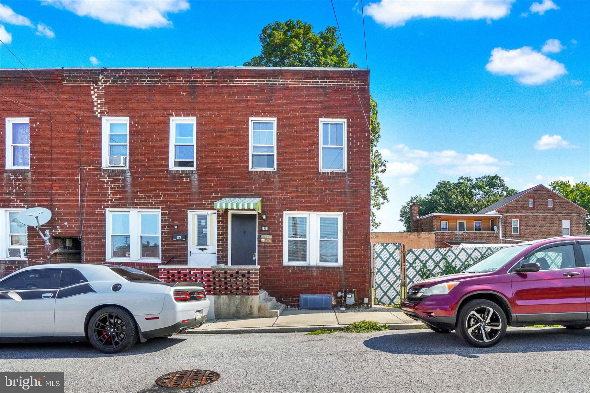 Discover the charm of urban living in this beautifully maintained end-of-row townhouse, a true gem built in 1925. This 2-bedroom, 1-bathroom home offers a perfect blend of historic character and modern convenience and features a a large fenced-in yard, a rare commodiuty in the city. The federal architectural style is complemented by durable luxury vinyl plank flooring, creating a warm and inviting atmosphere throughout. Nestled in a vibrant urban neighborhood, this property is surrounded by a rich tapestry of community life. Enjoy the convenience of nearby parks, perfect for leisurely strolls or weekend picnics, and take advantage of local shops and eateries that add to the neighborhood's unique charm. The area boasts excellent public services, ensuring a well-maintained environment for all residents. The location provides easy access to public transportation, making commuting a breeze and connecting you to the heart of the city. Imagine unwinding in your cozy home, with the street view offering a glimpse into the lively neighborhood. The basement adds extra storage space, while on-street parking ensures convenience for you and your guests. This property is not just a home; it's a lifestyle choice that embraces the best of urban living. Don't miss the opportunity to make this delightful townhouse your own!