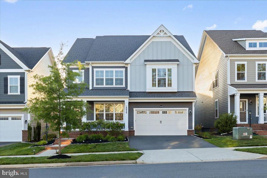 Welcome to 18020 Cedar Grove Lane — a beautifully appointed Beckner model located in the highly sought-after Potomac Shores community, where elevated living meets everyday comfort. Offering over 4,600 square feet, this residence combines spacious interiors, refined finishes, and the lifestyle today’s buyers are looking for. Featuring 4 bedrooms, 4 bathrooms, a 2-car garage, and a screened-in deck with retractable privacy shades, this home makes an impression from the moment you arrive! Step inside and you’re immediately greeted by light-filled spaces, luxury vinyl flooring throughout the main level, and elegant chair rail molding that adds a sophisticated touch throughout. The layout flows effortlessly, beginning with a versatile front living space ideal for a formal living room or dining room before opening into the true heart of the home. The rear living space seamlessly connects the grand room, dining room, and gourmet kitchen to create an open yet inviting atmosphere. The kitchen is both functional and beautifully designed, featuring granite countertops, an oversized island, gas cooktop with a statement hood, built-in wall oven and microwave, and abundant cabinetry that perfectly balances style and storage. Just beyond, the enclosed deck offers the perfect private escape for slow mornings, evening gatherings, or simply enjoying the comfort of home year-round. The main level also features a powder room, a bonus room ideal for a home office or play room, and a customized mudroom conveniently located off the garage entry. Upstairs, the spacious loft offers the perfect flex space for lounging, a reading nook, or a secondary living area. The primary suite feels like a true retreat, complete with a vestibule entry, dual walk-in closets, and a spa-inspired ensuite bath featuring separate vanities and a large walk-in shower. Three additional bedrooms, a full hallway bath, and an upper-level laundry room complete the upper level. The finished basement adds another layer of versatility to the home, beginning with a generously sized recreation area perfect for entertaining, relaxing, or everyday living. This level also features a full bathroom, custom barn doors that open to a secondary recreation space ideal for a media room, lounge area, or home gym, as well as an unfinished bonus room offering additional storage or future customization potential. Notable features of the home include a radon mitigation system, exterior sprinkler system, and the added peace of mind of a one-year home warranty included with the purchase! Beyond the home itself, Potomac Shores offers a lifestyle that is truly unmatched - residents enjoy access to resort-style pools, the Social Barn, Fitness Barn, Jack Nicklaus Signature Golf Course, Tidewater Grill restaurant, scenic walking/biking trails, basketball court, playgrounds, and peaceful views along the Potomac River. The HOA also includes high-speed internet and trash service, while easy access to I-95,  Quantico, and the future VRE station adds to the convenience of everyday commuting and travel.  Don’t miss the opportunity to purchase in one of the area’s most sought-after and steadily growing communities!! Schedule your tour today!