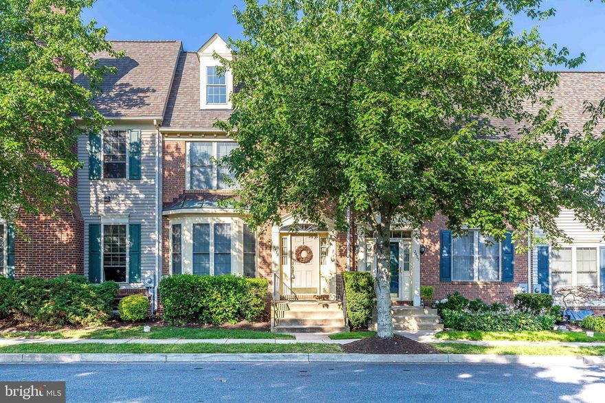 Highly sought after Wormans Mill-perfectly located just across from the pool & club house sits this brick front, 4 level home complete with loft. Front kitchen with breakfast nook offers tons of natural sunlight. Living/dining with wood floors, crown molding & gas fireplace.  Upper level laundry is so convenient. Huge primary suite with wood floors, cathedral ceiling, luxury bath with dual sinks, soaking tub & separate shower plus access to the loft with 2nd gas fireplace & storage room. 2 additional bedrooms plus hall bath complete the 2nd floor. Basement offers a rough-in for future added space. Detached 2 car garage is accessible from the rear patio.   Brand new HVAC  in 2022 . New roof (believed to be 2022). Buyers may wish to make some updates and the home is priced accordingly but this is a solid home with a premium location and move-in ready. Walk to pool, club house, shopping & restaurants.