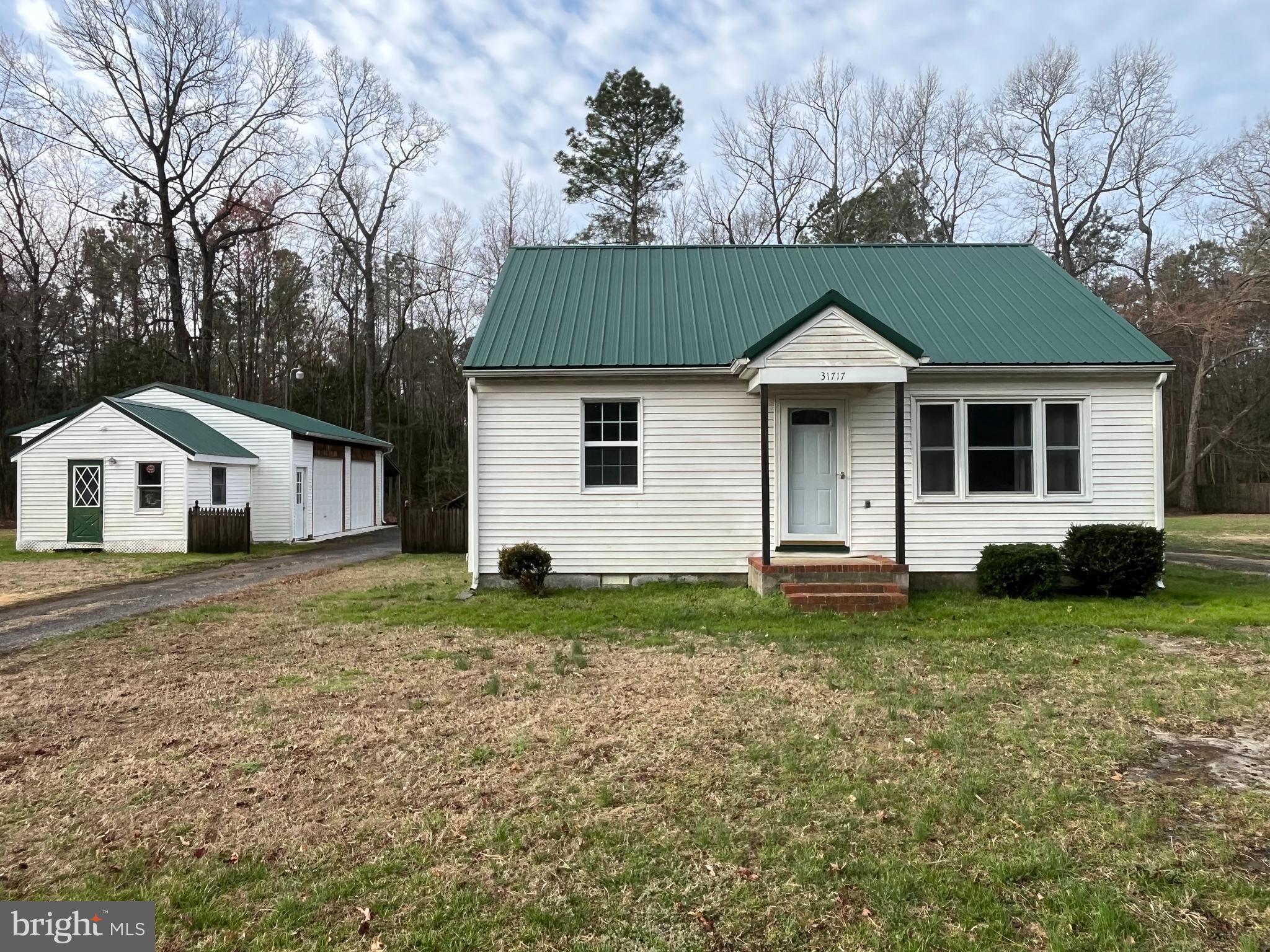 Charming 2-bedroom, 1-bath Bungalow home awaits your personal touches to bring out its true potential. The home is situated on a large rural 1+ acre lot. The home also has a second level with a large bonus space that could be set up for an additional living space. A new metal roof and a new HVAC system are just a couple upgrades that have recently been installed. There is also a large 2-car detached garage with an office area and extra storage space that could be perfect for starting a small business or just for personal use. In addition, there are 2 other outbuildings for your storage requirements. The home is being sold As-Is. No repairs will be made. Be sure to schedule your showing today and explore this home's potential.
