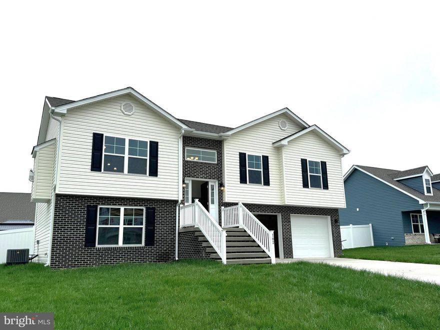 Under Construction 4 bedroom/ 3 full bath Split Foyer in Heritage Hills.  Home features open floor plan with vaulted ceilings in Family Room, LVP Flooring in main living areas, Natural Gas Fireplace in Family Room w/ mantle and Granite surround, and kitchen with island, granite countertops, recessed lighting, and stainless steel appliances.  The lower level offers additional living space with finished rec room, 3rd full bath and 4th bedroom.  Brick accents on exterior front and foyer, 10x12 rear deck, and concrete driveway included.  Interior Photos are similar construction