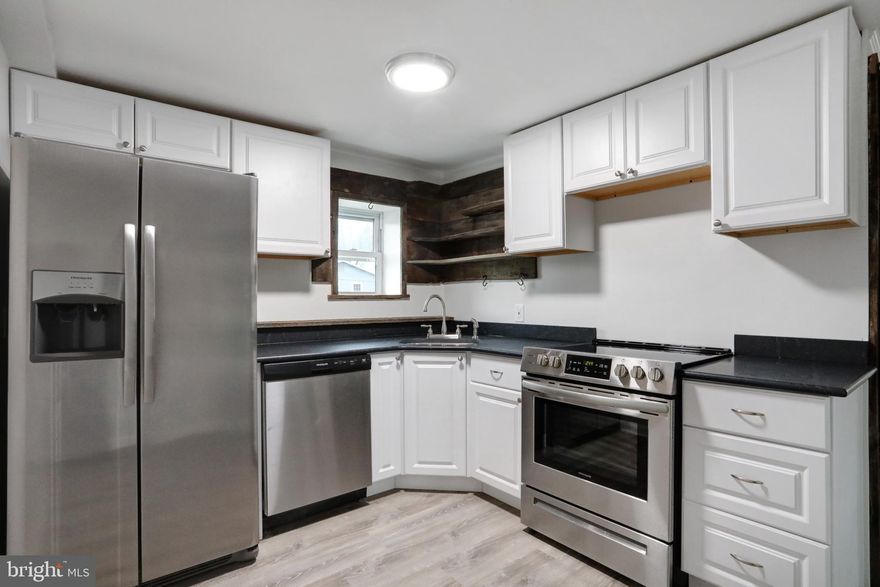 Entirely renovated apartments for rent. Kitchen features reclaimed wood island and granite counters. Large living room with decorative fireplace and new light fixtures. Excellent location, one block from Historic District, shopping and restaurants. Rent includes two assigned parking spaces. Washer and dryer in unit.