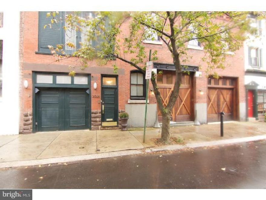 2 bedroom, 2.5 bath, 2 car GARAGE parking & deck. Walk in through the garage to media room & 1 bedroom with full in suite marble bathroom, complete with large Jacuzzi tub & walk in shower. Continue up the rear flight of stairs to the modern, open U shaped kitchen with Viking stove, Sub-Zero refrigerator, granite counter tops & wine storage. Open dining & living space, 3 large windows with southern exposure, fireplace & hardwood floors. Master bedroom is also on the 2nd floor, 3 closets, high ceilings, skylights & full bathroom. Powder room & closet in the hallway. From the living area, up a flight of stairs is a library/office space, overflowing with light. Up a few steps to the roof deck, with built in gas grill, water source & plenty of room for entertaining & container gardening.