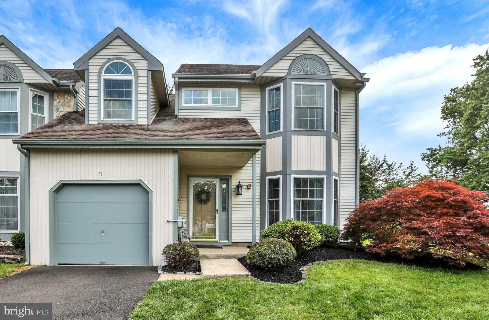 OPEN HOUSES Friday 4-7 and Sunday 11-2. Welcome to 14 Spruce Court — a beautifully updated end-unit townhome tucked into the sought-after Newtown Grant community, just minutes from shopping, dining, parks, and all within the award-winning Council Rock School District. Step into the light-filled two-story foyer and take in the open-concept living and dining area featuring elegant crown molding, chair rails, and bay windows. The main level is finished with hardwood floors and Levelor cordless blinds for a clean, modern look. The custom-designed kitchen features recessed lighting, granite countertops, shaker-style soft-close cabinetry, a breakfast bar that opens to the family room, subway tile backsplash, wet bar, and radiant heated floors. Sliding glass doors off the kitchen lead to a large backyard patio—perfect for entertaining. Stainless steel appliances include a double oven and microwave, along with a newer dishwasher and new refrigerator. The adjacent family room is centered around a gas fireplace and features soaring cathedral ceilings that flood the space with natural light. A remodeled powder room, laundry area with newer washer and dryer, and interior access to the garage complete the main level. Upstairs, the primary suite is designed for comfort and relaxation, with a spacious layout and a luxurious en suite bath designed to be both elegant and functional, with granite dual vanities, an oversized shower with seamless glass doors, thoughtfully designed tilework, and generous storage. Two spacious bedrooms and a remodeled hall bath offer ideal space for guests or a home office. Newer carpeting has been added throughout the upper level for comfort and style. Outside, enjoy one of the largest lots in the neighborhood with a beautifully installed paver patio—a private setting for gatherings or quiet mornings. A new water heater adds peace of mind, while other thoughtful upgrades ensure comfort and efficiency throughout. Residents of Newtown Grant enjoy access to fantastic community amenities including a pool, clubhouse, tennis courts, playgrounds, and walking paths. All of this just minutes from charming and historic Newtown Borough, known for its unique shops, local restaurants, coffee spots, and vibrant events year-round. This is more than a home—it’s a lifestyle. Don’t miss your chance to live in one of Bucks County’s most loved communities! With a new roof, new water heater, refreshed exterior work, and thoughtful updates throughout, this home is move-in ready with confidence.
