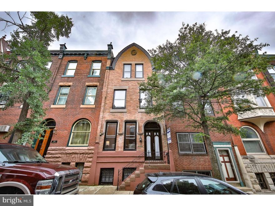 OPEN HOUSE CANCELLED!!! Absolutely Extraordinary Townhome w/ private parking situated in the heart of Philadelphia's most exclusive residential neighborhoods and literally steps from beautiful Schyukull River Park. This exceptional 5 bedroom Fitler Square Residence is a true rarity due to its original architectural details that have been preserved both inside and out; only the most discerning buyer will appreciate its spaciousness and elegance, making themselves a proud owner & continuing a tradition of those who have lived here since the early 1800s beginning with members of the distinguished Bower Family, some of the country's first chemists and U of Penn Graduates. Some of the fabulous architectural elements include three huge gorgeous FPs featuring intricate wood carved mantles, original stain and lead glassed windows, a stunning carved oak 3-story staircase and Grand-scale formal rooms with soaring ceilings, massive windows and rich original wood flooring throughout. First floor offers wood paneled vestibule with double doors leading to massive Living Room w/ elegant powder room towards the back, a spacious Formal Dining Room which leads to an lovely updated sun-soaked kitchen. In back you'll find a large area with just enough room for a quaint brick patio and beyond that plenty of space for at least one car (private parking can be accessed from small street behind Spruce complete with new metal garage door w/keypad & automatic garage door opener). Second Floor boasts 2 amazing spaces: Master Suite: its own bath featuring whirlpool tub, separate shower and double sinks, and more than ample closets; and across the hall a stunning room currently being used as the residence's Family Room boasting gorgeous Fireplace, tons of windows and double doors leading out to what could be a wonderful 2nd floor patio. Third floor offers 3 more generous sized bedrooms with good storage and a stylish full hall bath. There is just so much to love about this home - truly a rare gem in one of the city's most celebrated neighborhoods!