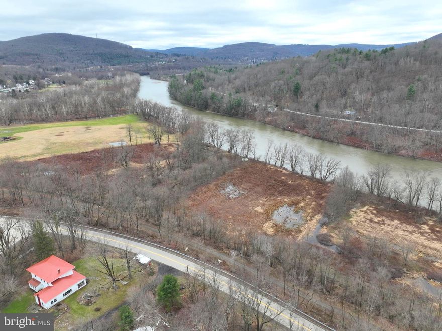 Start your own farm to table lifestyle on this beautiful 115 AC farm located in Susquehanna County with river frontage on the Susquehanna River. The property features a well maintain 1900 Farmhouse, along with a large barn and chicken house where 100 dairy cows and 20,000 chicken called it home. The farmhouse is in very good condition, and it is obvious how well maintained it has been. The property is more rolling hills than mountainous, and is partly wooded with trails where the cattled roamed. Once a working farm, there are many acres on the property that used to be tillable/hayed, especially the land bordering the river. There is well over 2,000 feet of water frontage along the river allowing for great fishing and boating. The farmhouse features 2,854 sq. ft. of living space including 5 bedrooms and one bath. There has been numerous upgrades in the past 20 years including a new metal roof in 2008, new chimney flashing, new furnace, new kitchen wall and door, wood floors upstairs, all well piping in 2022, and new hot water heater and Pella windows about 10 years ago. One fireplace exists but was replaced with propane, and that tank is rented. The property is enrolled in the Clean and Green program, and all OGMs convey, but the oil and gas was leased (will convey) for 5 years in 2025, with a 5-year extension allowed. If you are ready to enjoy the peace and quiet of farm life with possible royalties coming your way, this may be a property worth looking into. Don't wait, schedule your private tour today!

There is subdivision potential on the property with up to 10 or more lots available.
