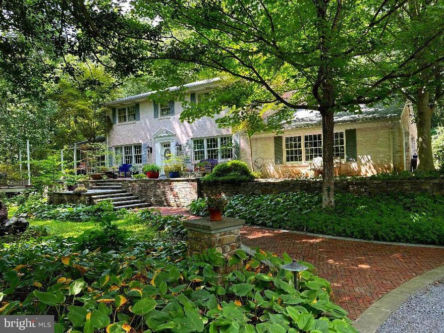 An amazing opportunity to own in the highly sought-after community of Highland, MD. This property showcases a lifetime of artistic architecture and engineered landscaping. A labor of love—a love for natural habitats and a passion for the elements of nature—has transformed this space into a serene oasis. The exotic plantings of shrubs, trees, and ground coverings throughout the property make it a true one-of-a-kind.
It’s unique, with exquisite views and enchanting driveway-width trails that lead to Serenity Pond. There are multiple sitting areas that offer private, meditative sanctuaries, surrounded only by the sounds of nature: birds chirping, water rippling in the brook. This is a real treasure, featuring authentic stone retaining walls, stone bridge backwalls, two natural spring-fed ponds, and a cleared plateau (80' x 30') pre-leveled for a potential future build.
The first building you'll see on the left as you approach the home is a separate 2,500 sq. ft. gallery/studio. with extra large wood burning fireplace, Antique Safe in the Office,is to convey w/property, all on the main level, Lower Level, includes an industrial-grade workshop in the lower level with 3-phase electrical supply, and a wood burning stove. This building features extra-large, strapped-hinge rough-sawn oak doors on both levels to accommodate large sculptures or other oversized pieces. The gallery, as we call it, was over-engineered for live load and large-scale artwork. It would also be ideal for yoga, dance, or workout classes—its uses are only limited by your imagination.
Continue up the gravel driveway to the circular drive and you'll find a luxurious red brick herringbone walkway leading to the main house and two patios. To the right is a flagstone sitting area; to the left, an oversized octagonal patio constructed with exotic wood decking and steel columns. Magnificent for night entertainment, w/Mardigra  Lights, Party Ready. This patio now awaits your personal touch. It features a built-in center firepit, Gourmet Grill, and overlooks Serenity Pond, and is adjacent to the large screened in Porch.
Finally, the house itself: a spaciously designed floor plan with 5 bedrooms, 3.5 baths, 3 wood-burning fireplaces, a fully finished walk-out basement, and a 2-car garage directly off the kitchen—perfect for unloading groceries during inclement weather. The home is bathed in natural light throughout.

There is so much more to see. Touring this extraordinary property and experiencing its serene mystique will make it hard for you to leave.

Please Note: All showings require 24-hour notice. The listing agent or owner will be present. No walk-ups. Please respect the owner's privacy—without an appointment, you will be considered trespassing. Be sure to click on icon in top ledger of the listing for virtual tours videos, Video Tittle, "It's A Different Kind of Peace", Thanks