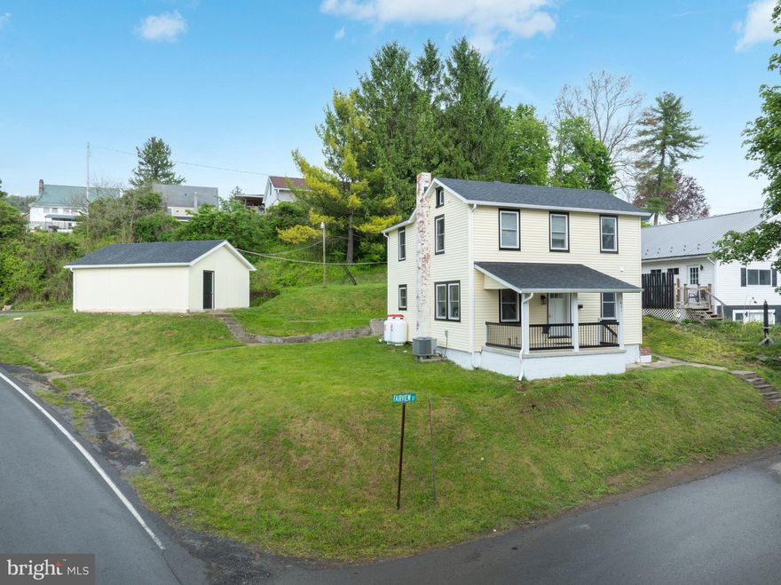 OPEN HOUSE: Sun, May 17 12:00 PM - 1:30 PM | Move in ready sweetheart on Halfmoon Hill. Renewed with care & redesigned for today’s lifestyle, this Bellefonte two story shines inside & out. Perched on a .25 acre parcel, this fully remodeled home has been renewed with craftsmanship & an eye for timeless comfort.  The exterior has been updated with new Pella double hung windows, a new roof, gutters, soffit, fascia, exterior lighting, upgraded exterior doors, added landscaping & newly installed porch railings and posts on the covered front porch restoring the appeal of this welcoming entry.  Inside, the home opens to a fresh, modern interior where every detail has been touched. Natural interior paint choices, all new flooring, updated lighting, new interior doors, a complete electrical rewire with a 200 AMP panel, recessed lighting, and brand new PEX plumbing create a clean, cohesive backdrop for everyday living.  The sun filled living room sets the tone, polished & inviting with engineered hardwood flooring & recessed lighting that softly highlights the space. It’s a room made for slow mornings & quiet evenings.  The bright, beautifully updated kitchen blends modern style with everyday functionality. Crisp gray cabinetry pairs with Allen + Roth solid surface countertops & included stainless appliances, while engineered hardwood flooring ties the space together. A center island adds prep space, seating & storage, plus multiple windows pour in natural light, giving the room an uplifting energy.  Just beyond, the darling dining room offers its own moment, a space ready for weeknight meals, holiday spreads, or those spontaneous gatherings that turn into memories. It’s intimate & comfortable. A convenient remodeled half bath & a handy laundry/mudroom with exterior access perfect for muddy boots, wet paws & everyday comings & goings complete the first floor.  Upstairs, the second floor delivers a serene owner suite with new carpet & a private full bath with ceramic tile flooring & a walk-in shower. Two additional bedrooms & a home office all with new carpet are complemented by a refreshed second full bathroom with ceramic tile flooring.  Outside, a rear concrete patio leads to the detached, freshly painted 2 car garage, now boasting its own new roof, gutters, soffit & fascia, along with a 100 AMP electrical entrance. It’s a versatile space ideal for storage, hobbies, or weekend projects.  Major improvements continue throughout, including all new HVAC, heat pump, central air, new ductwork, propane forced air backup heat, hardwired smoke detectors, a vapor barrier & stone floor in the basement & fully replaced millwork, including upgraded baseboards, window casings, trim & shelving.  Just moments from Historic Downtown Bellefonte, Spring Creek, Fisherman’s Paradise & an easy commute to State College & Penn State University, this home blends modern comfort & convenience with small town charm. Every inch has been thoughtfully transformed with hard work & heart, all ready for its next chapter.