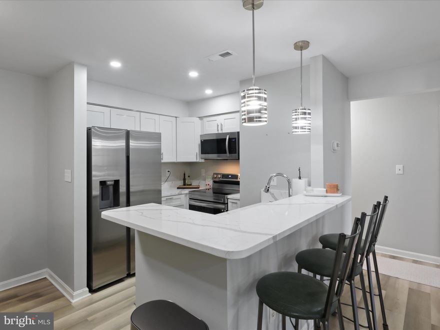 Completely Renovated and Rarely Available 1 BR / 1 BA Condo in Quiet Courtyard Style Victoria Crossing at Manchester Lakes Community in Kingstowne! Upon entry you are met with inviting neutral paint, laminate vinyl plank flooring and recessed lighting throughout open concept kitchen / dining room / living room combo floor plan. Kitchen includes stainless appliances, updated white cabinets, quartz counters and breakfast bar that overlooks living area with functional wood burning fireplace. Off of the living area is door that leads to exterior patio for outdoor living space.  The bedroom also includes luxury vinyl plank flooring and is adjacent to fully renovated bathroom with custom vanity, tile flooring and tile tub / shower combination.  The laundry closet nearby includes newer stackable washer and dryer.   Condo includes one assigned parking space and there is plenty of visitor parking in the community. The community includes use of community center, two outdoor pools, tot lots and tennis /pickleball courts nearby and is in an excellent location close to I-95, I-395, Route 286 and within  2 Miles of Metro, for commuting purposes.  Community is also adjacent to Kingstowne Shopping Center that includes Walmart, grocery store, restaurants, coffee shops, retail stores and AMC movie theaters. Condo is available on February 15th, 2025 and pets will be considered on a case by case basis.