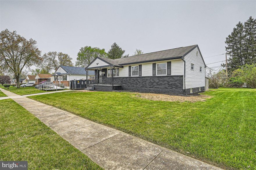 Newly remodeled inside and out, 4BR/2BA Rancher located on a quiet street in a desirable neighborhood.  Step up to the cozy covered front porch and open the door into your forever home. The open concept floor plan boasts tons of natural light, easy care flooring, recessed lighting, and so much room for family and friends.  A large living room opens to a spacious dining room with a view of the kitchen.  The kitchen boasts plenty of cabinets including a pantry, stainless steel appliances, quartz countertops with a stunning tiled backsplash, and a half wall separating the kitchen from the dining room offering breakfast bar seating for three or more.  Down the hall is a large primary bedroom with two closets, two sizable secondary bedrooms, and a beautifully tiled full bath.  The lower level is finished offering the fourth bedroom, a full bath with walk-in shower, laundry, storage, and a large family room with space for everyone. Sliding doors in the dining room takes you to a large wood deck that overlooks a yard filled with tons of green space and a storage shed.  This home is move-in ready with so much to offer new homeowners and is located within close proximity to shopping, restaurants, and commuter routes.