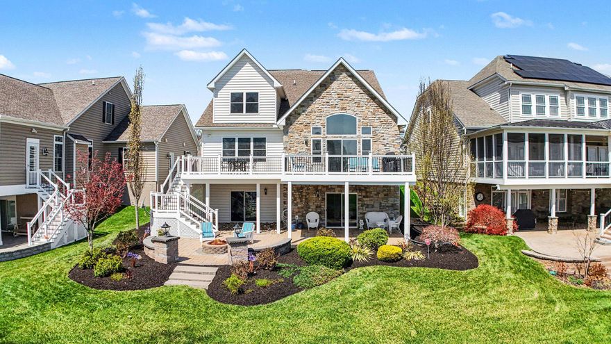 Sited on one of the most coveted homesites in the community, this exceptional property backs directly to the Bulle Rock golf course.  Everyday is an opportunity to enjoy sweeping views of the manicured greens.  Beyond the fairway, distant panoramic views capture the convergence of the Susquehanna River and the Chesapeake Bay.  The backdrop of this home delivers breathtaking scenery during all seasons.  This Clark Turner home built in 2014 offers 5 bedrooms and 4.5 baths and is just shy of 5,000 square feet of finished living space. Features include hardwood flooring on the main level, a gourmet kitchen, a great room with a barrel ceiling, beautiful molding throughout and a main level primary suite.  Just off of the foyer is a sun-filled library,  perfect for a reading room or versatile office space.  The kitchen offers a center island, a Wolf gas range, a pot filler and an eat-in area for casual dining.   The great room opens seamlessly to an expansive composite deck overlooking the golf course creating the perfect flow of indoor-outdoor living.  Entertaining or quiet morning coffee feels effortlessly elevated set against the stunning view.  Relax in the spacious main level primary suite with  2 closets, a primary bath with a soaking tub, a walk-in shower and a double vanity.  Upstairs is a large loft creating a great versatile space for guests or everyday living.  3 large bedrooms and 2 full baths offer great guest space.  The lower level features newly installed carpet, a huge recreation room, a bedroom, full bath, a separate room that would make a great exercise room/playroom/office or theater room.  There is no shortage of storage space with 3 separate storage rooms.  Walk out to an expansive paver patio with a built-in firepit, knee wall and lantern lighting.  Beautiful landscaping frames this property and every view feels like the ultimate retreat.  This home is one street over from the driving range and a short drive or walk from the golf clubhouse and Bulle Rock Pub & Restaurant.  The gated community features a 37,000 sq ft Residents' Club with a fitness center, indoor and outdoor pools, billiard room, a library, ballroom, meeting rooms and more.  A full-time lifestyle director plans endless activities with something for everyone.   Live where everyday feels like a private club experience.