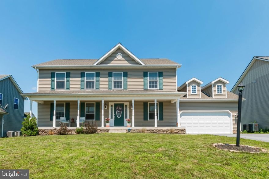 Warm and inviting, this 4 bedroom 2.5 bathroom two-story colonial is a curbside charmer with an open air front porch and large eat-in kitchen waiting for company.  Greeted at the door with hardwood floors and a traditional floorplan that features a formal dining room with wainscoting and crown molding, a formal living room, and a family room that flows into the kitchen.  Enjoy the outdoors off the deck and into the mostly flat back yard.  Four well-sized bedrooms upstairs, including an owner's suite with separate tub and shower - plus a huge walk-in closet.  Unfinished basement with rough-in for additional living space and bathroom or perfect for storage, workshop, or hobby space.  Home includes SimpliSafe security system and Ring doorbell for added safety.  Beautiful, move-in ready home in a desirable neighborhood - come take a look and don't miss out!