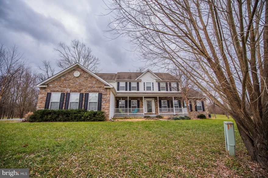 Luxury Upgrades & Great Commuter Location, colonial home with front porch, this home features a well Kept 5 Bedroom, 3.5 Baths! Amazing Gourmet kitchen with Granite Countertops, center Island with cooktop, two wall ovens, opens to the Sun Room with French Doors. This Home Is Great for Entertaining.  A larger model home with solarium. The Family Room features a cathedral ceiling with a beautiful Stone gas fireplace! Featuring 2 Master Suites, one offers a large sitting Area, vaulted ceiling & luxury master bath with soaking tub, separate shower & double vanity. A Jack and Jill bathroom. Oversized, walkout, unfinished basement with a bathroom.  Fenced in back yard. Move in ready house with stone siding and huge 3 car garage makes this property s curb appeal top-notch.